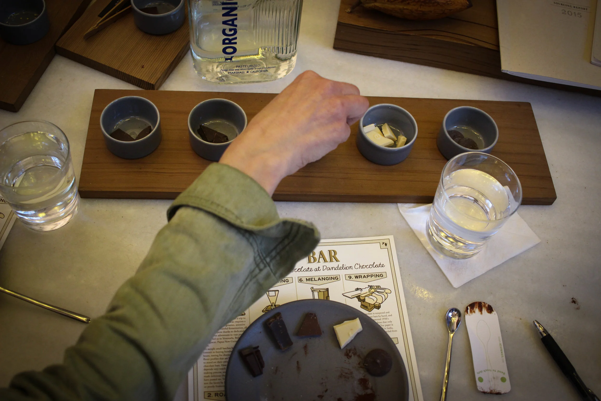 Nicole tasting all of the chocolates, right to left.