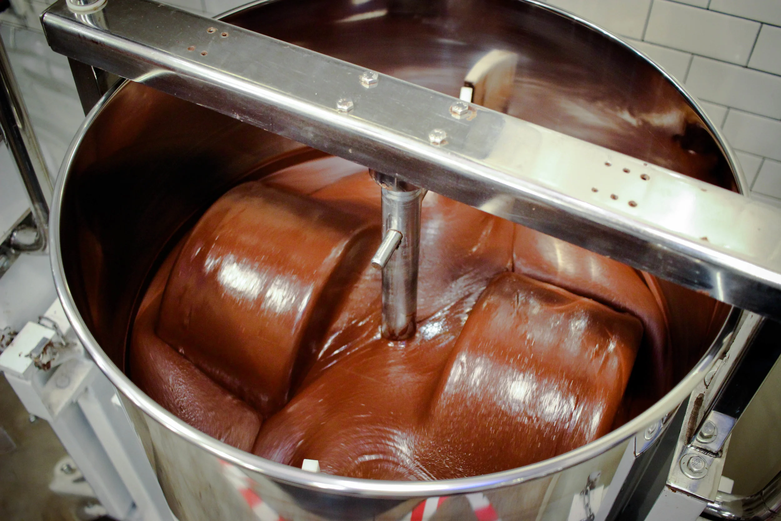 Conching the chocolate to make it extra smooth.