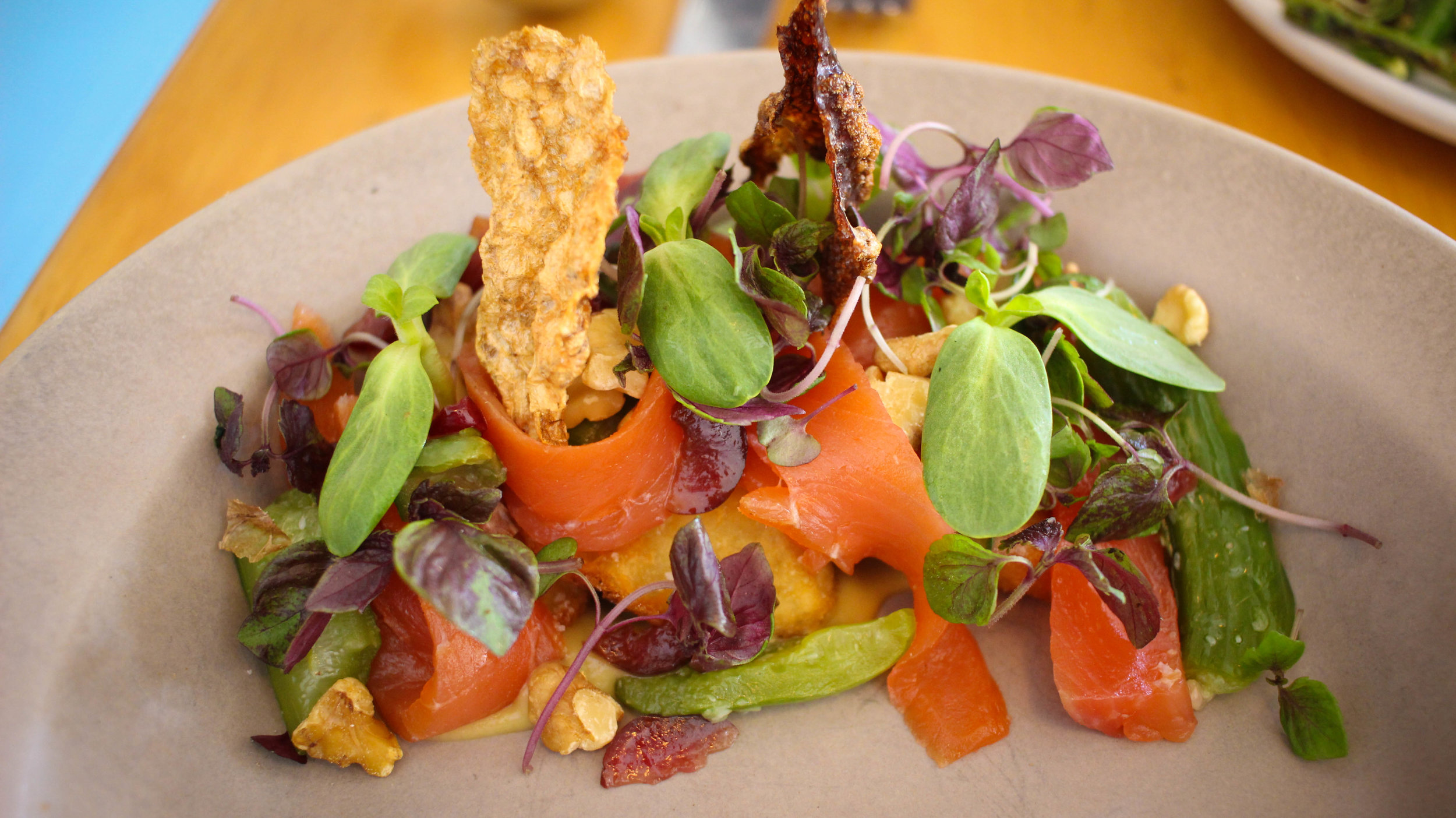 Lightly cured trout, crispy potato, bashed cucumber, and bagna cauda.