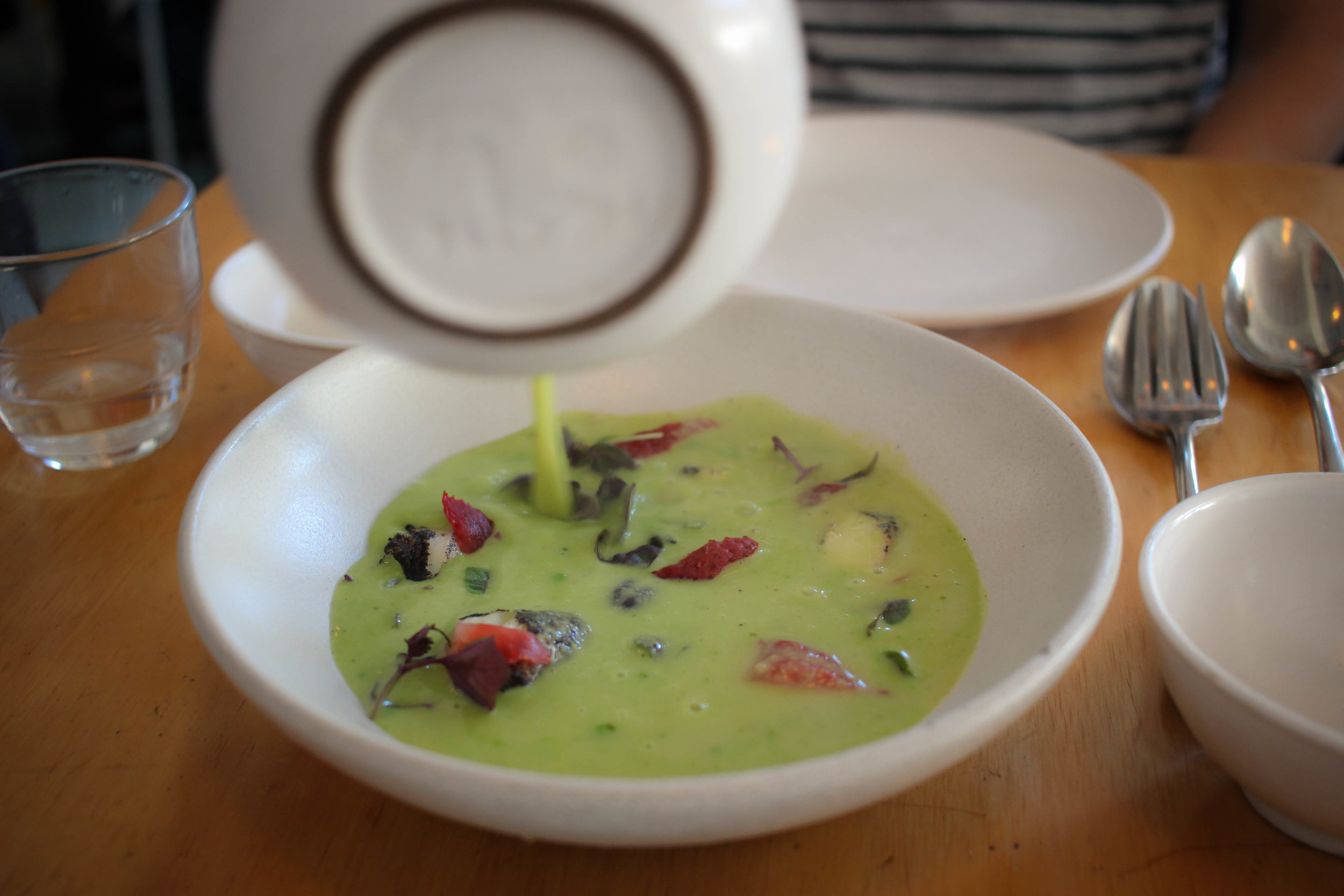 Green pea curry, black lime-cod, and pickled strawberries
