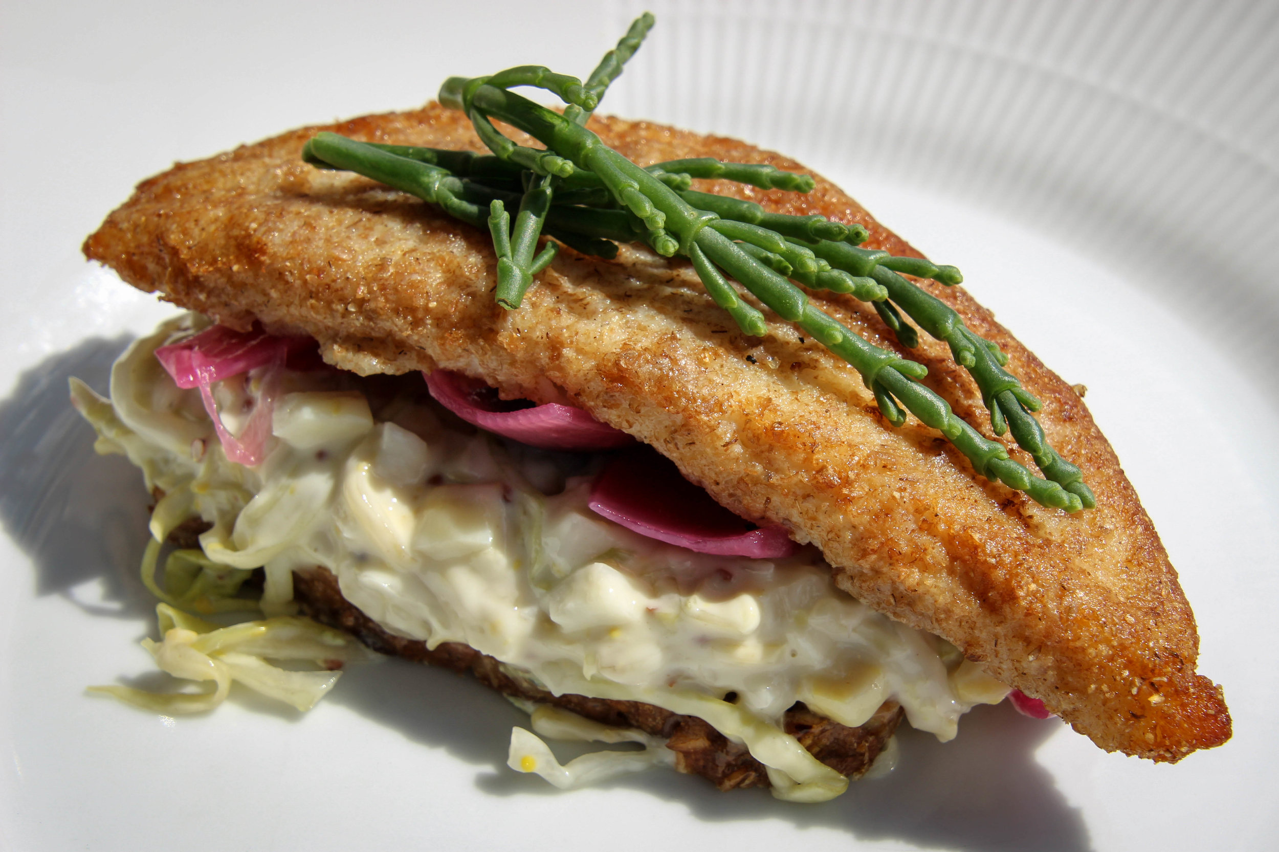 Fish fillet with pickled cabbage, glasswort and creamy kale