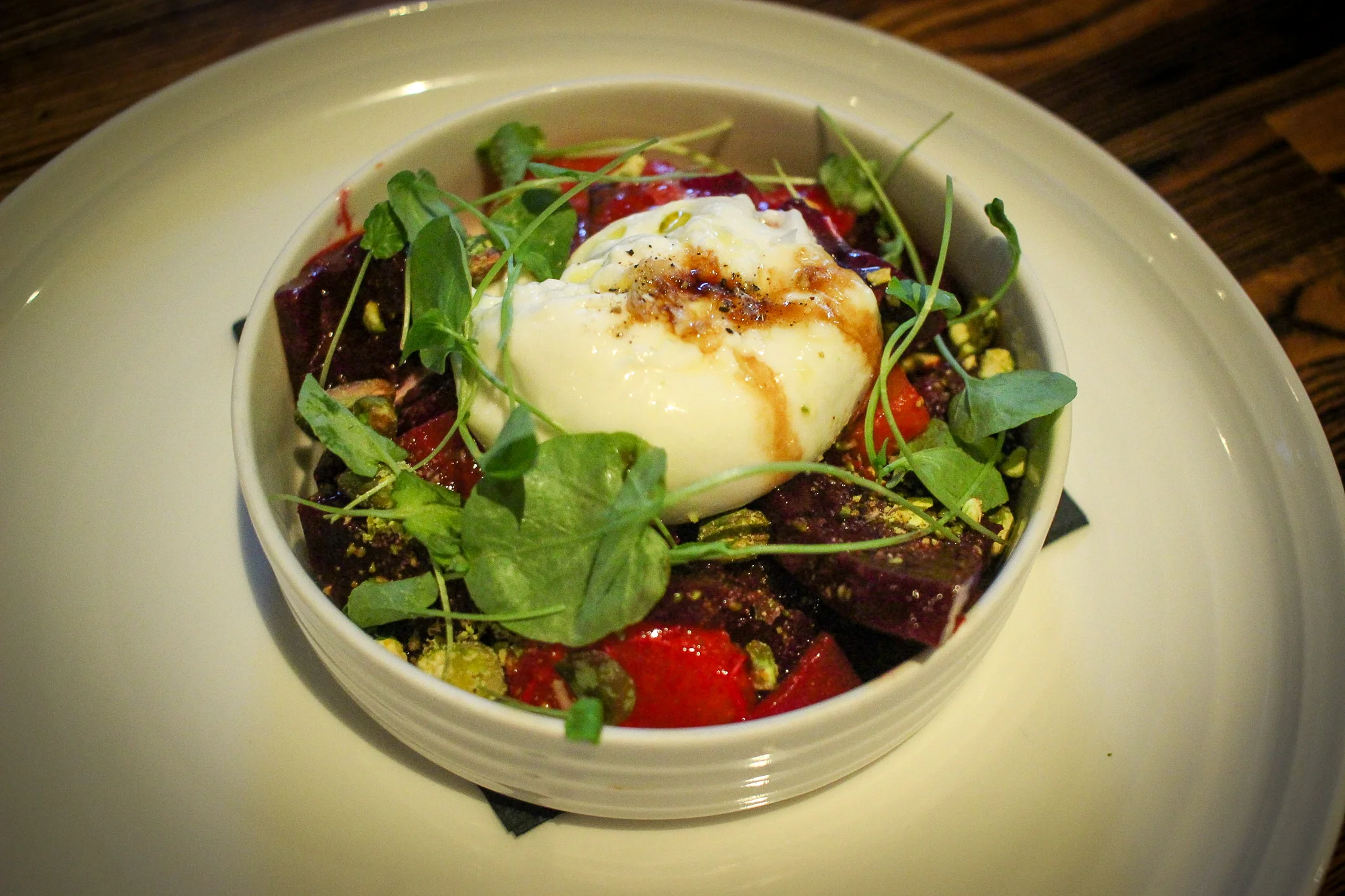 Smoked burrata with beets, citrus, pistachios, and Calabrian chilies