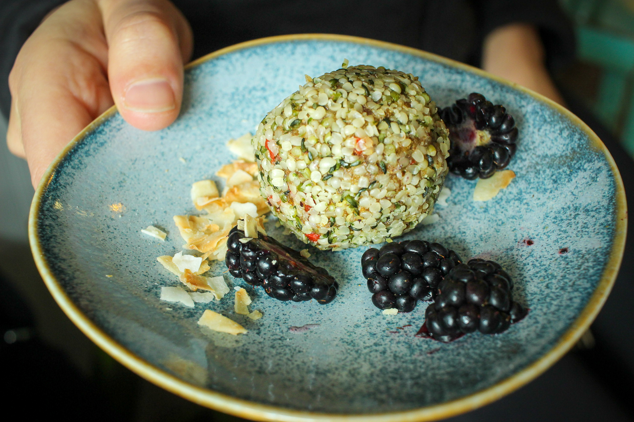 Adaptogen ambrosia ball: dates, goji berries, golden berries, hemp seeds, chia seeds, coconut butter, maca, cinnamon, cardamom, coconut oil.