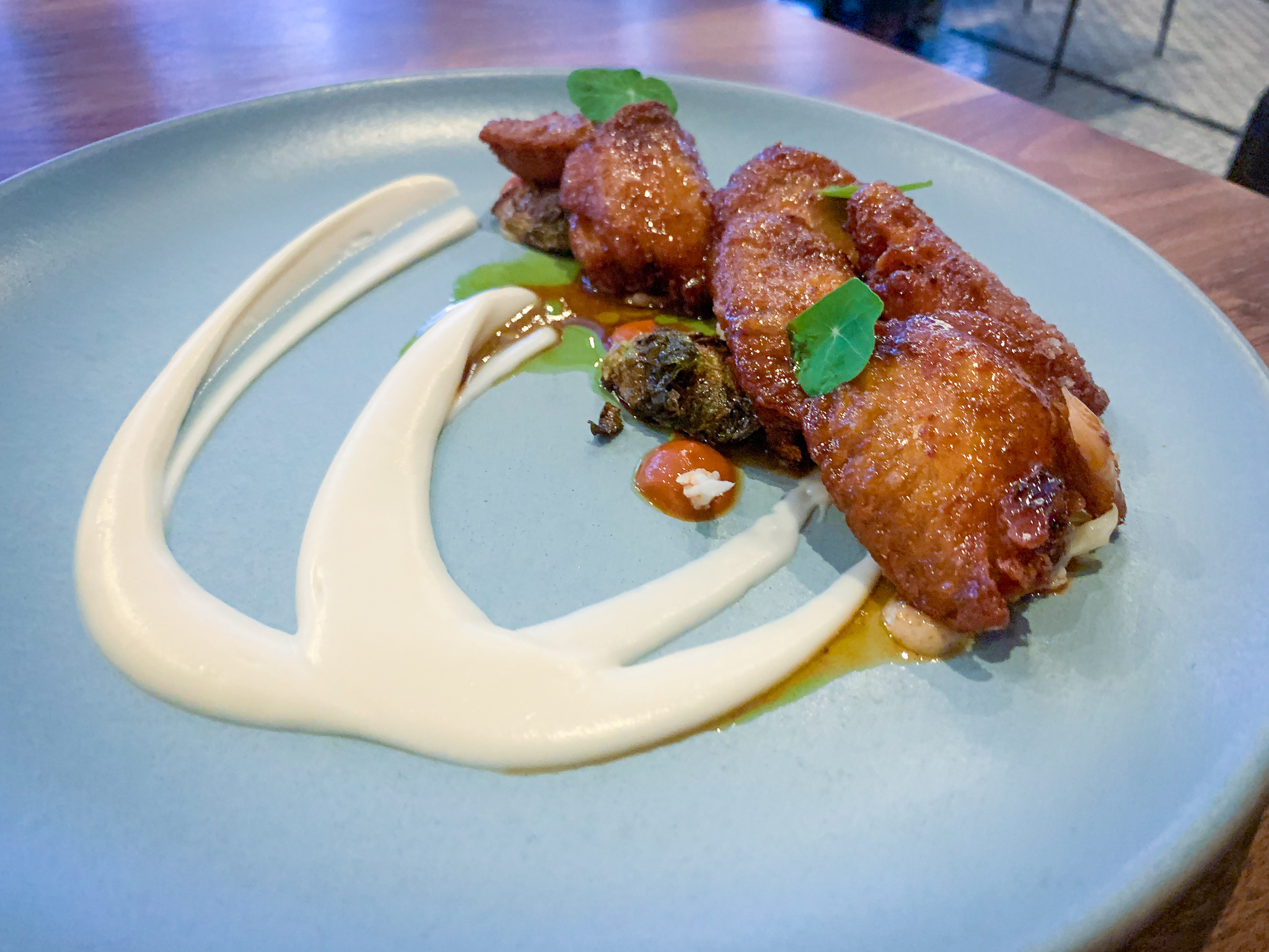 CHICKEN WINGS burnt honey . cauliflower . brussels sprout . lemon glaze