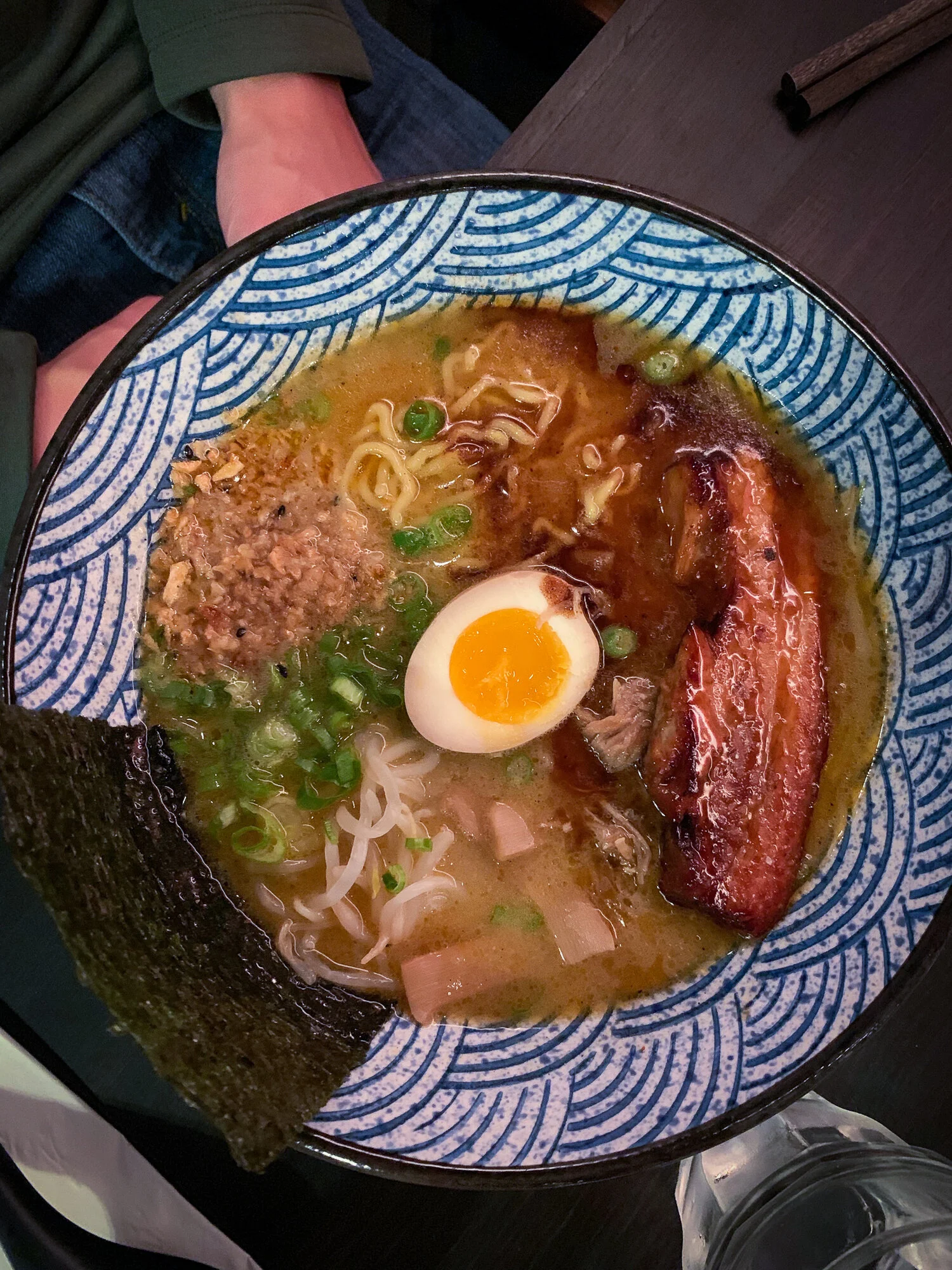 Signature Pork Ramen: thick tonkotsu style 20 hour pork broth, pork chashu, 1/2 golden egg, bamboo shoots, bean sprouts, scallion, black garlic oil