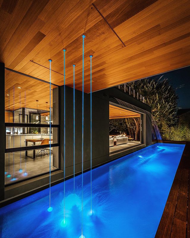 Having fun with custom laminar water features that look like light sabers coming out of the ceiling. Acacia House. 📷 Steve King. #hunterleggittstudio #acaciahousela #waterfeature #modernpool #whynot .....
.
.
.
.
#architecture #designbuild #modern #