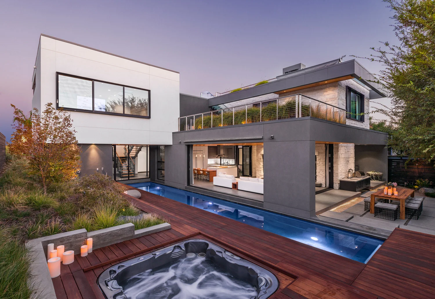 Acacia House modern pool, landscaped roof garden terrace and roof deck with fire feature. The indoor outdoor design provides natural tranquility through the house.