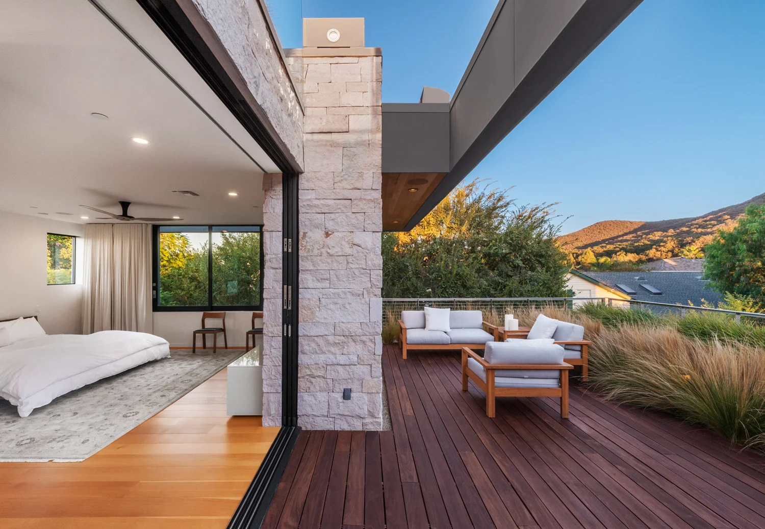 Acacia House modern landscaped roof garden terrace with fire feature and indoor outdoor master bedroom