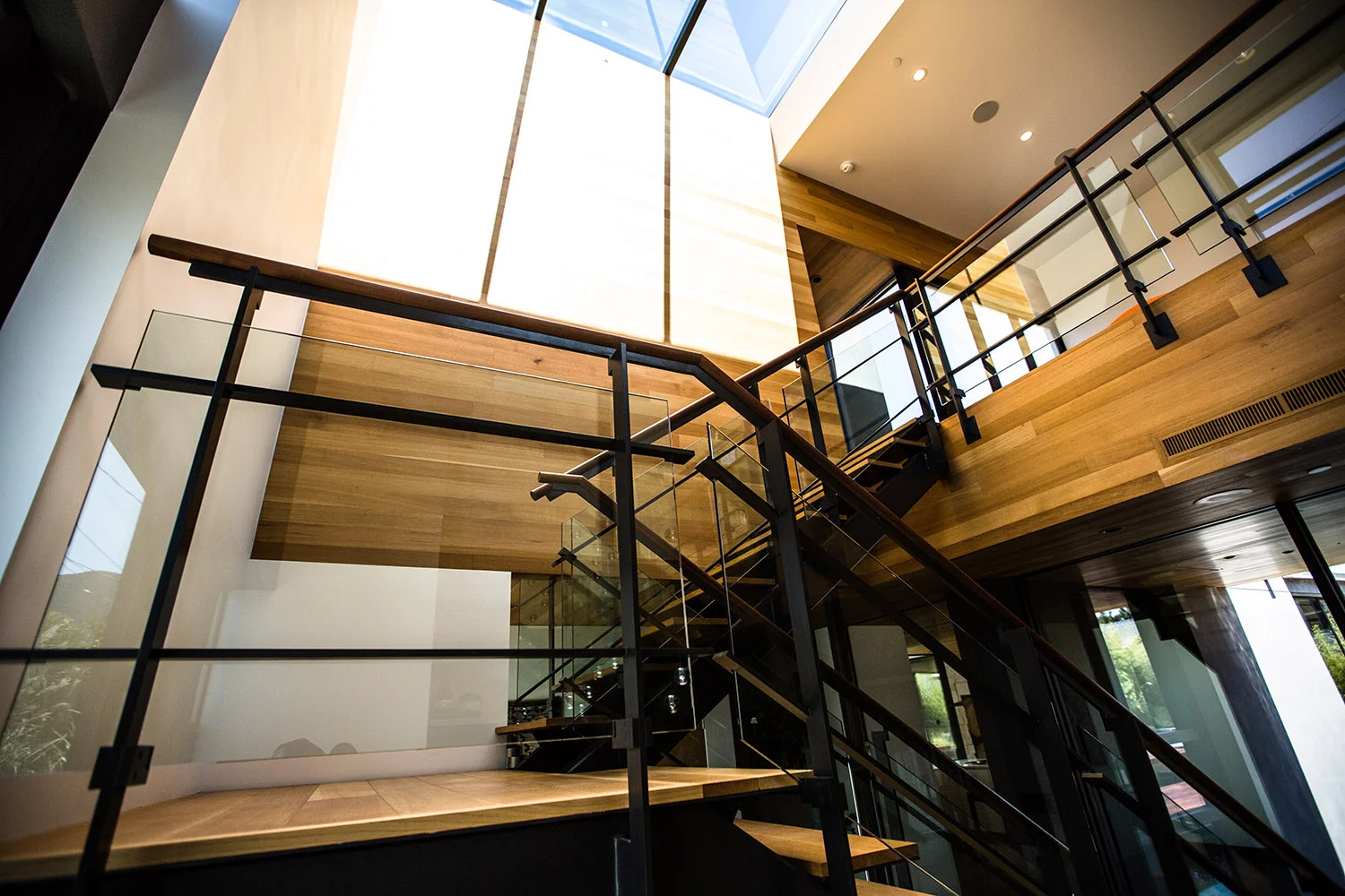 Acacia House custom modern staircase and large skylight
