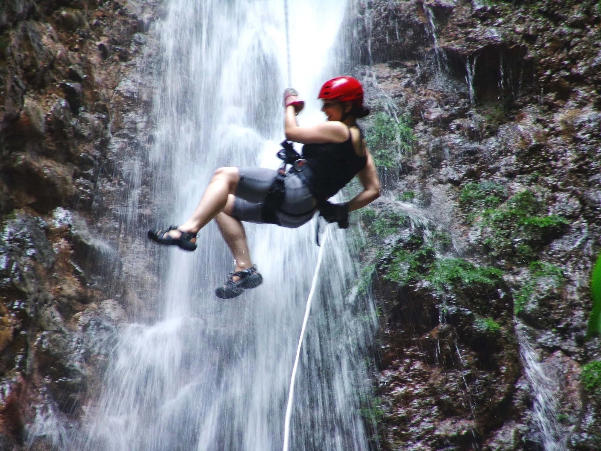 Rappeling down a waterfall