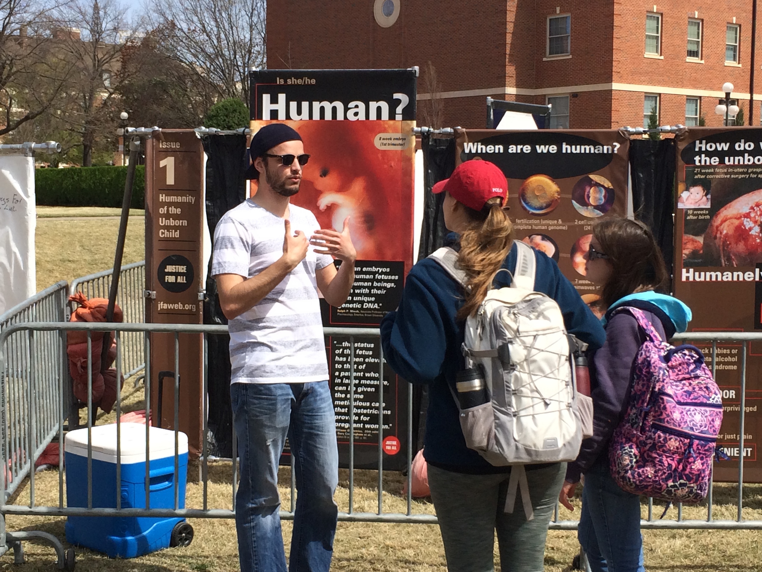 March: During outreach at Oklahoma State University (OSU), JFA Volunteer Carson Banks (who also helped invite JFA to campus through his work with the OSU student organization Cowboys for Life) interacts with other OSU students.