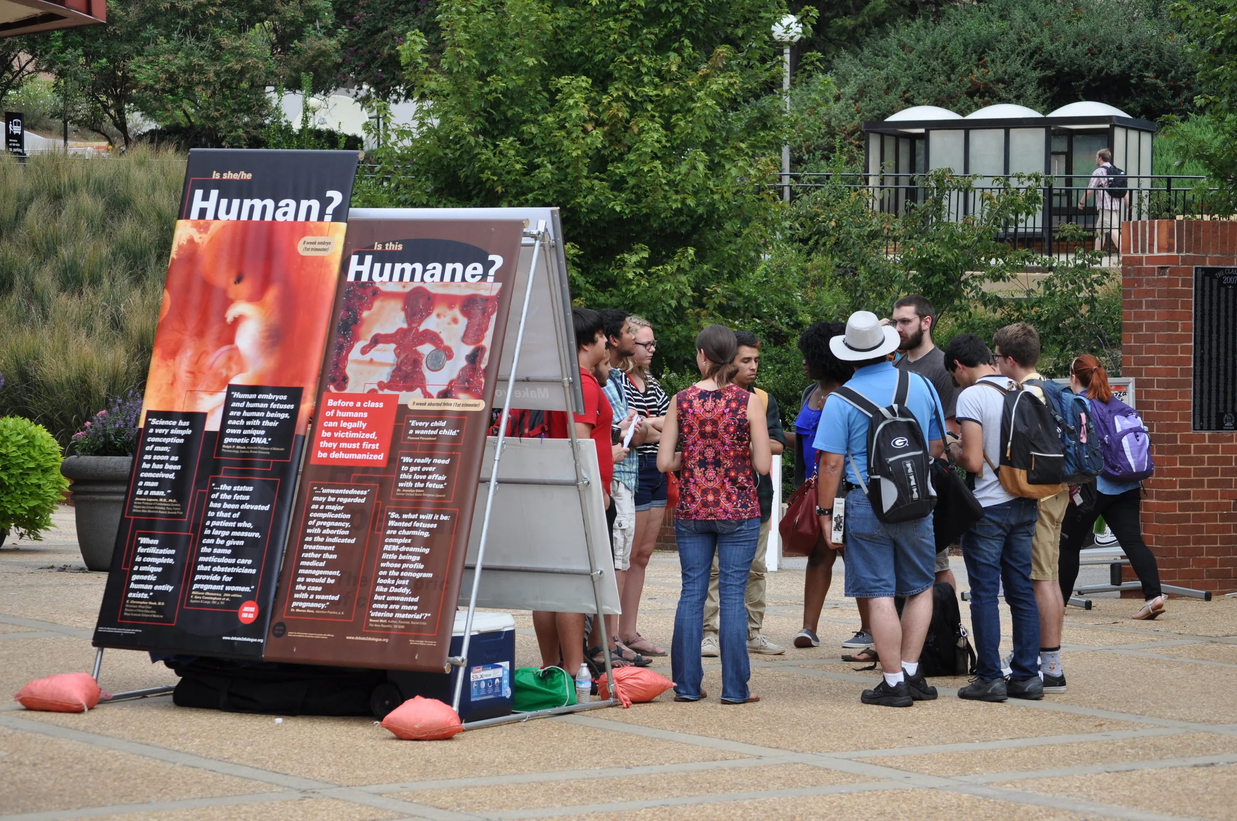 The JFA Exhibit (2000) panels displayed at UGA on the day CK met Jamie. Jamie was referring to the "Is this humane?" panel when she said, "That photo condemns me to hell," and CK was able to share the message of Christ's forgiveness with her.