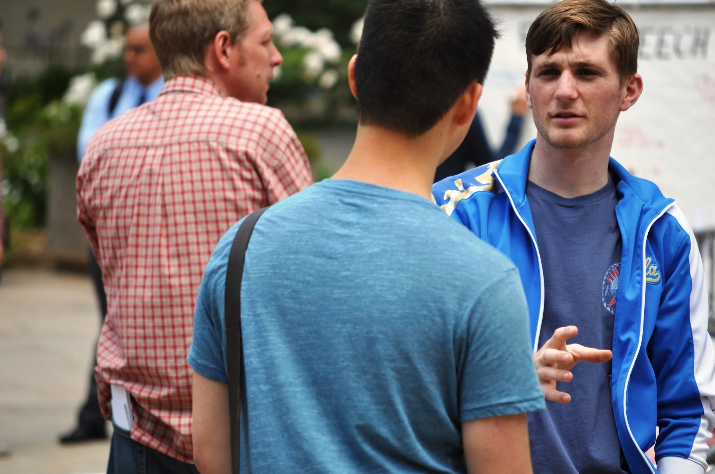  Nathan, a member of Live Action UCLA (right), interacts with a fellow UCLA student in May 2016. 