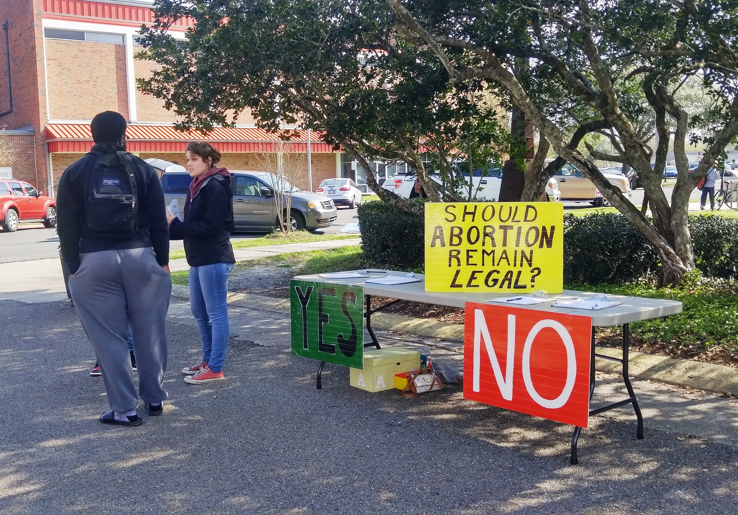 Grace (right) engages Bryan (left) in conversation at Nicholls State.