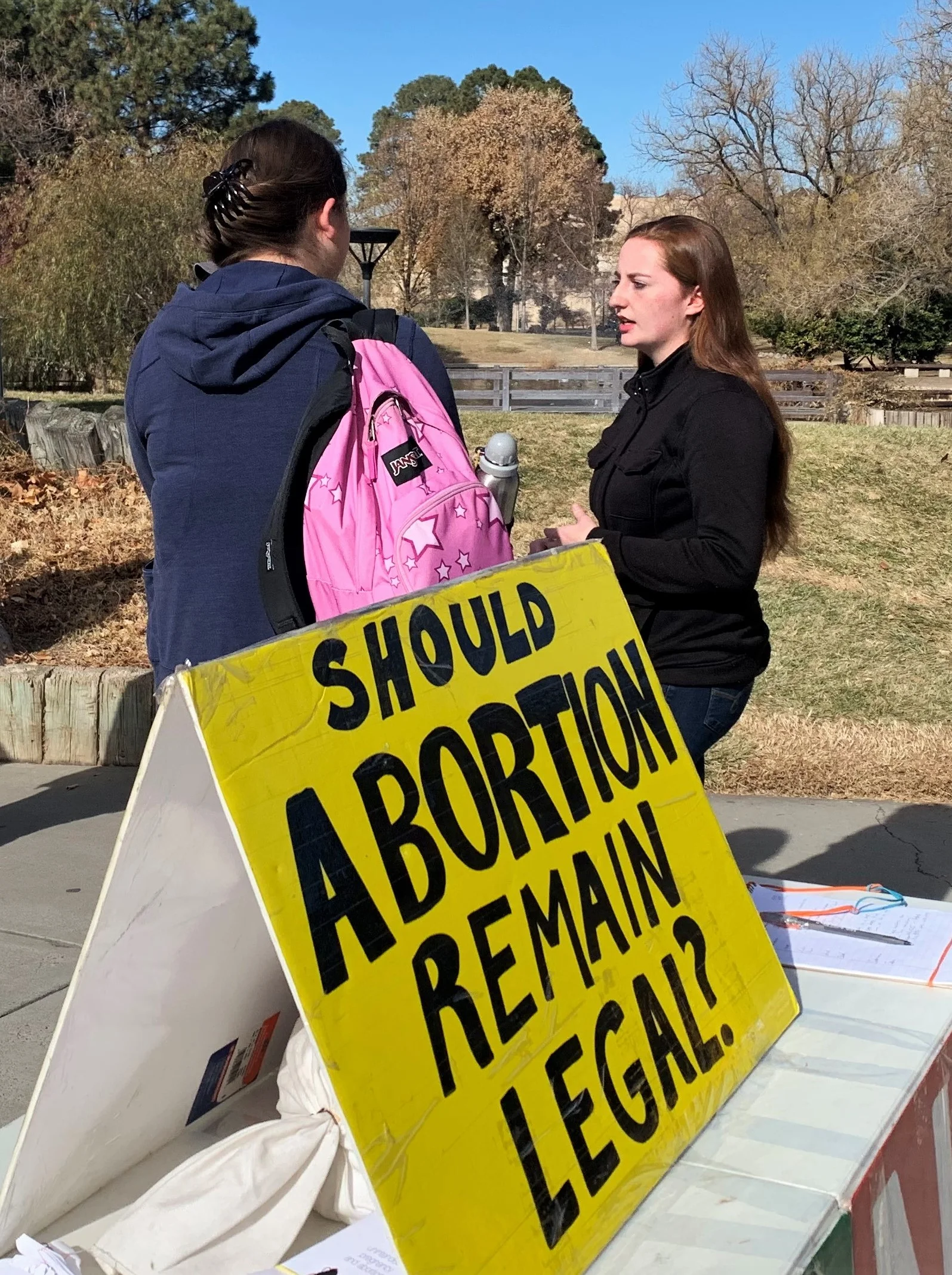 Julia talks with a fellow student during JFA’s outreach event at the University of New Mexico (UNM) in November 2018.