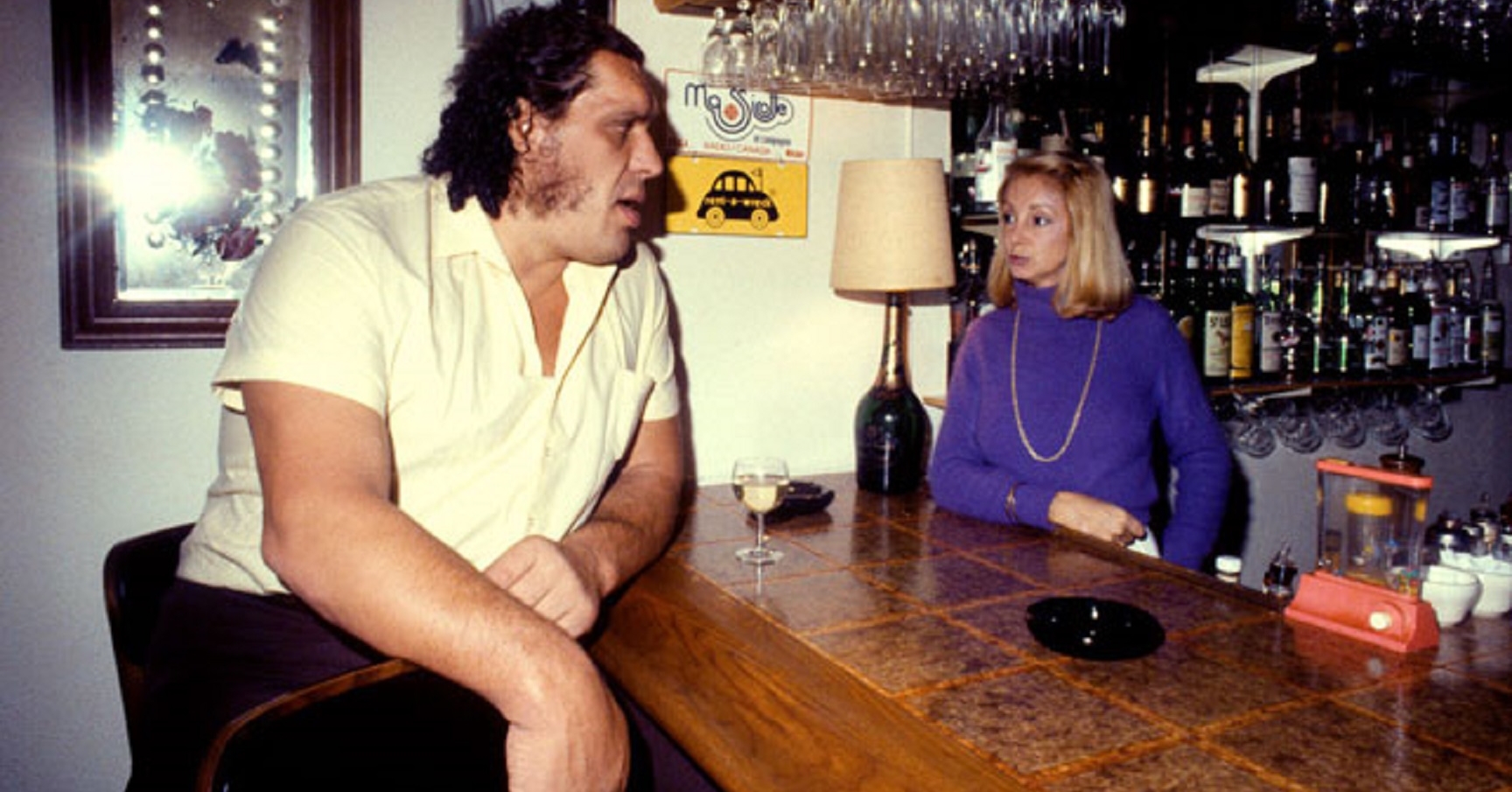 BARTENDER, politely: "Can I start you off with something to drink?" ANDRE, intently: "All."