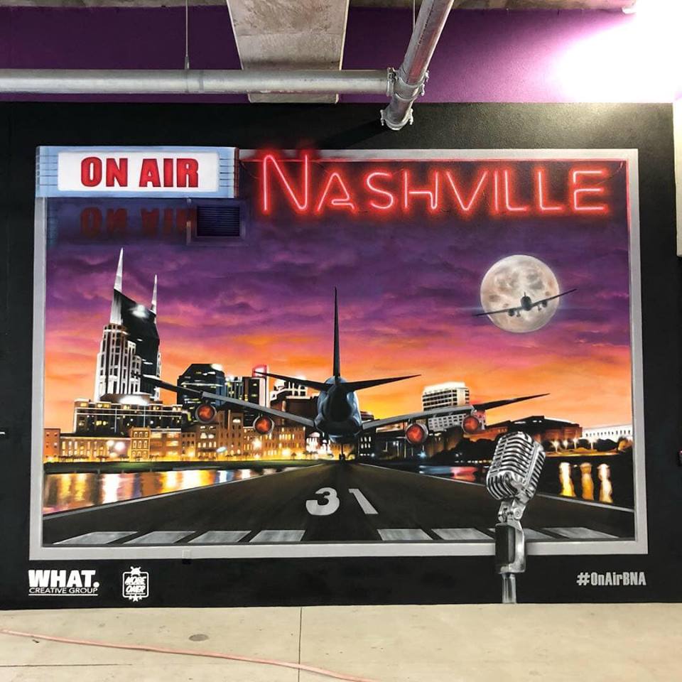 On Air - Nashville International Airport On Air is a collaboration by Nashville based artists Jake Elliott and Eric “Mobe” bass. This piece was designed to give Nashvillians and visitors a fun interactive, and snap-shot worthy experience. The work’s title is a play on words, paying homage to the rich musical history of Nashville and incorporating aviation and the aircraft that bring people to and from Music City every day.