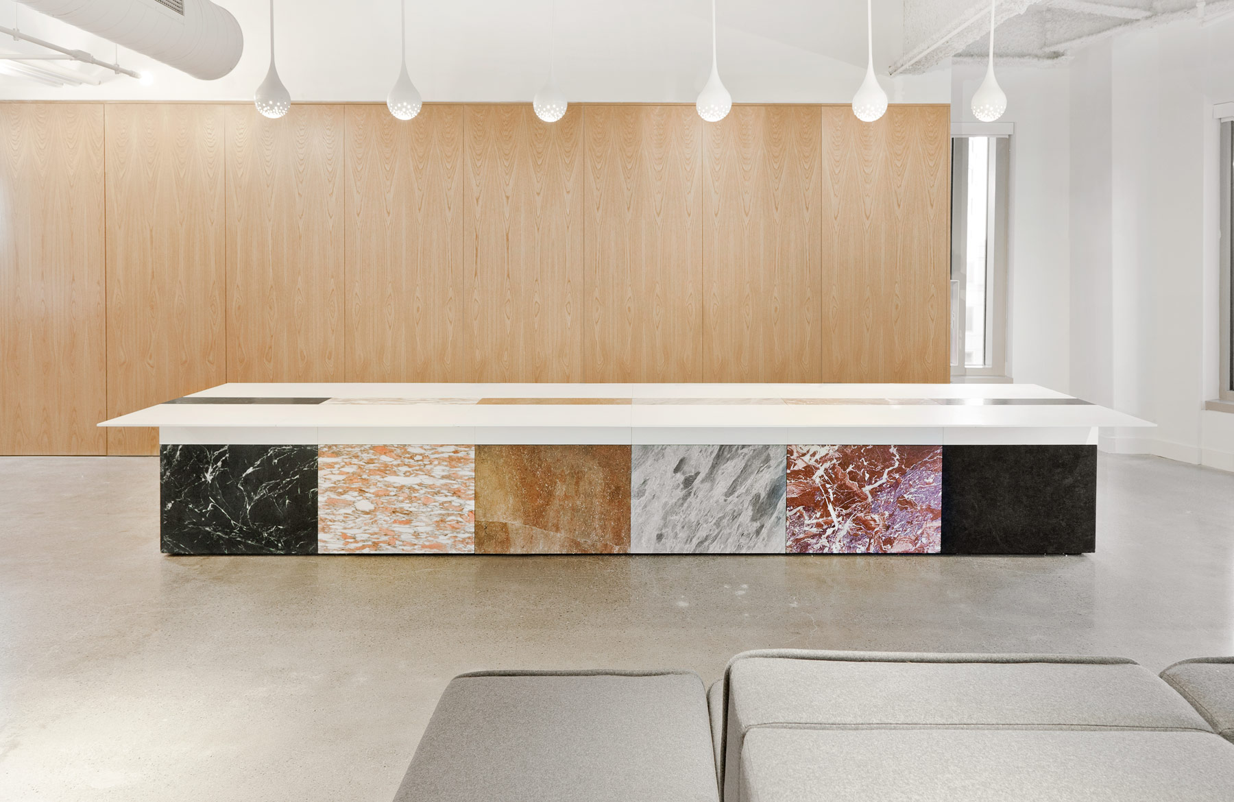The first of two tables is 36 feet long, and made of bent steel and maple plywood veneer. The table was designed and engineered in 4 sections so that it could be fabricated by local craftsman in Los Angeles and shipped to Atlanta.