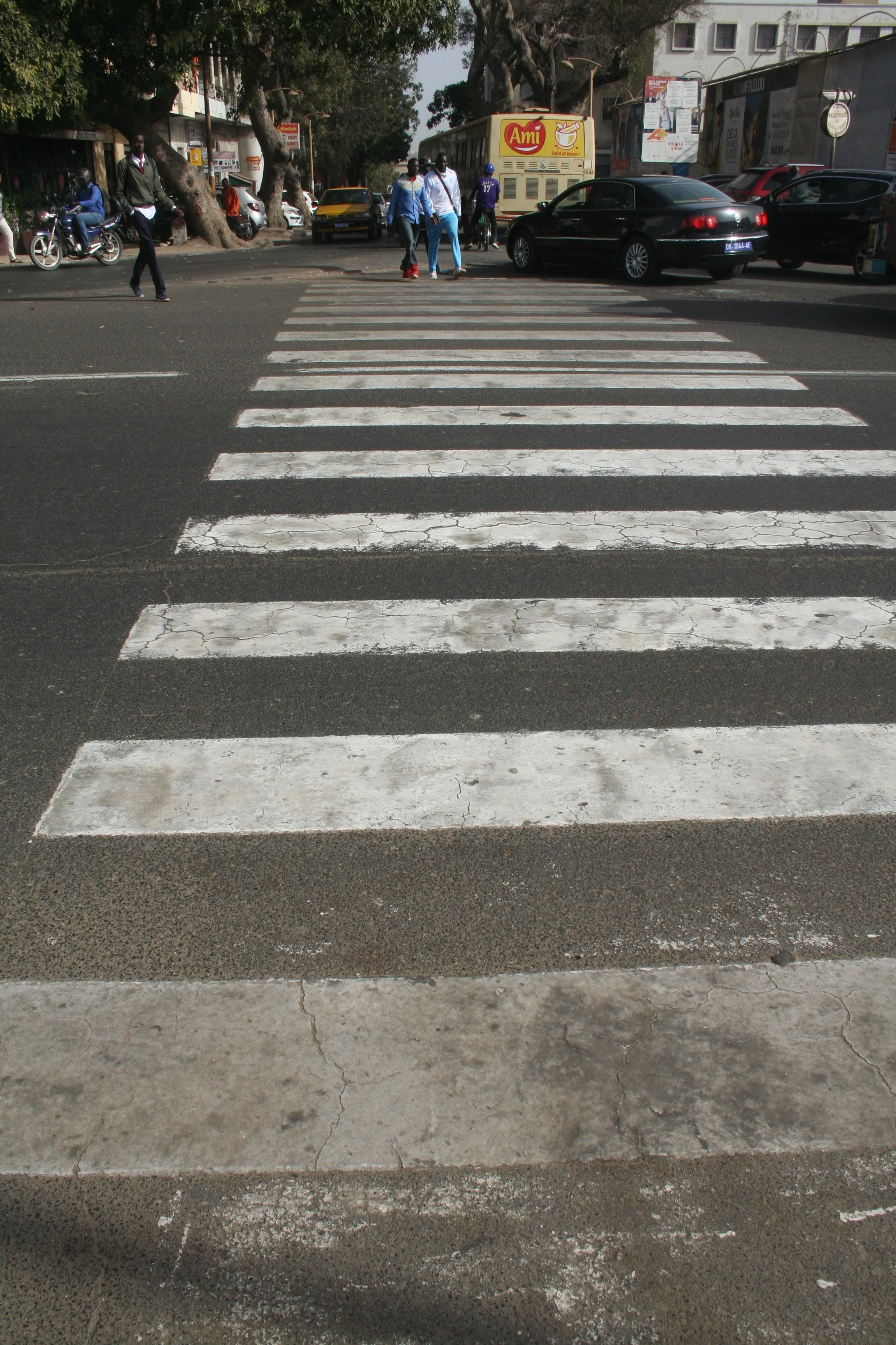  A crosswalk that leads into the  middle of traffic.   