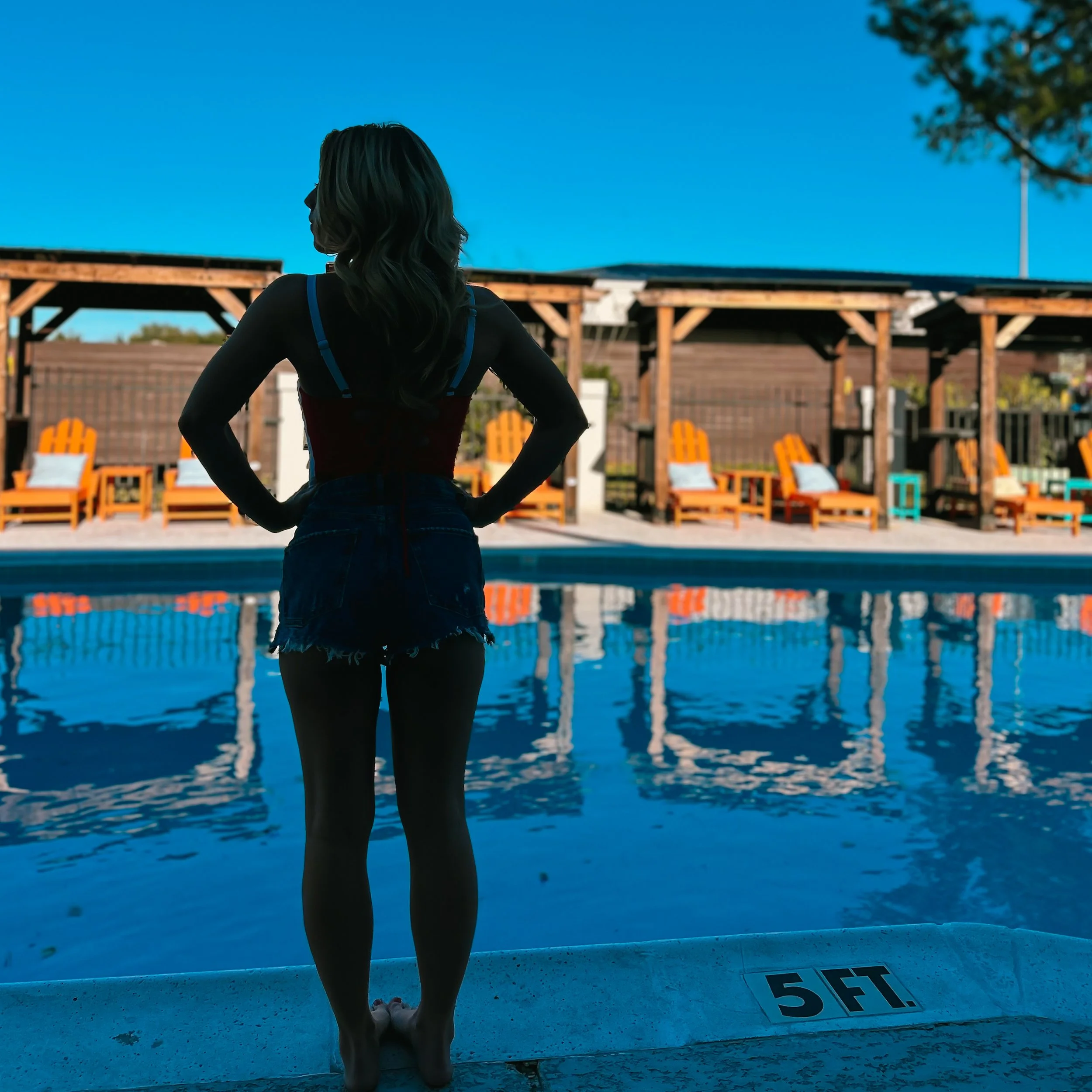 Woman at resort looking at the pool - Hotel McCoy College Station