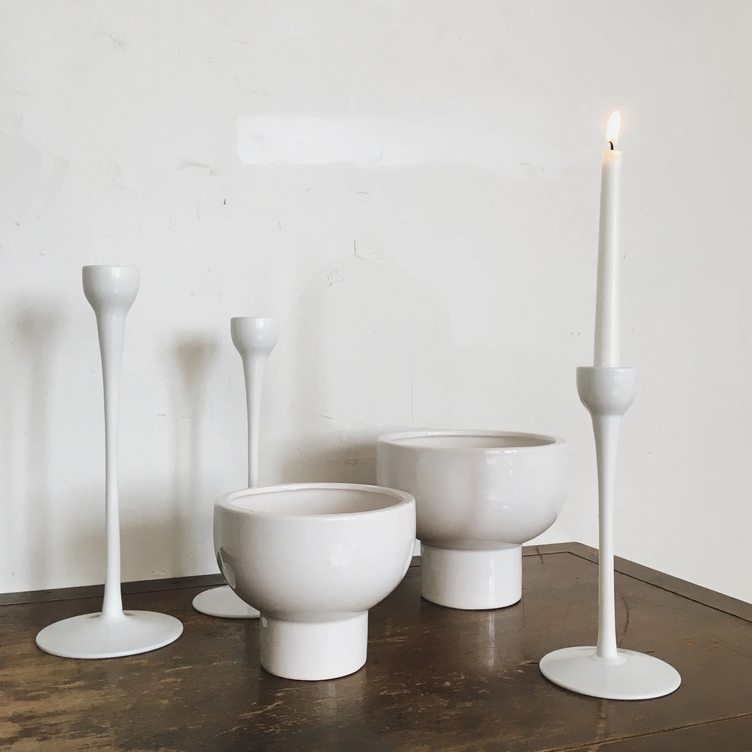  Modern white compote (9) - 5 x 7" Modern white compote (1) - 6 x 8" Modern white candlesticks (21) - 9, 11 and 12" tall 