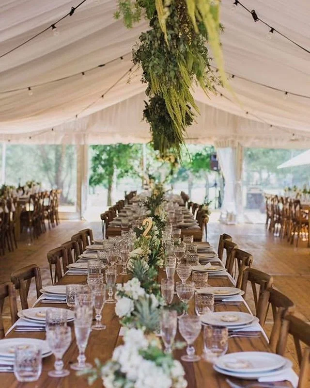 A white marquee, wood cross back chairs, recycled timber tables and festoon lighting are a recipe for a spectacular outdoor wedding! @gohiretheeventpeople have the know how and equipment to make your wedding as memorable in the looks-department as it