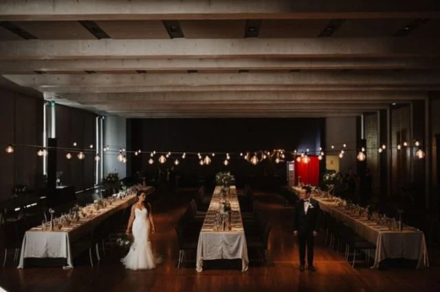 A wedding reception in the Gandel Hall at the @nationalgalleryaus in Canberra is sure to impress even the toughest critic! The hall is spacious, exquisitely detailed with gold-leaf doors and red ironbark floors. Driven by a passion for food, a commit