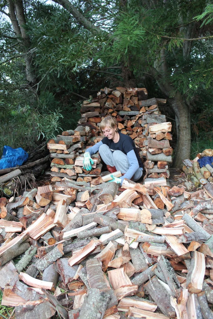 While Wolf, Samuel, Eli and neighbor "AB" machine split the wood, Casey and Michelle stacked the day away.