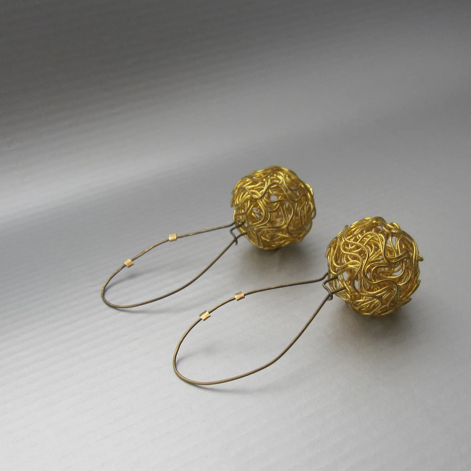 nido earrings in reclaimed bronze and brass (2.5 in in length)