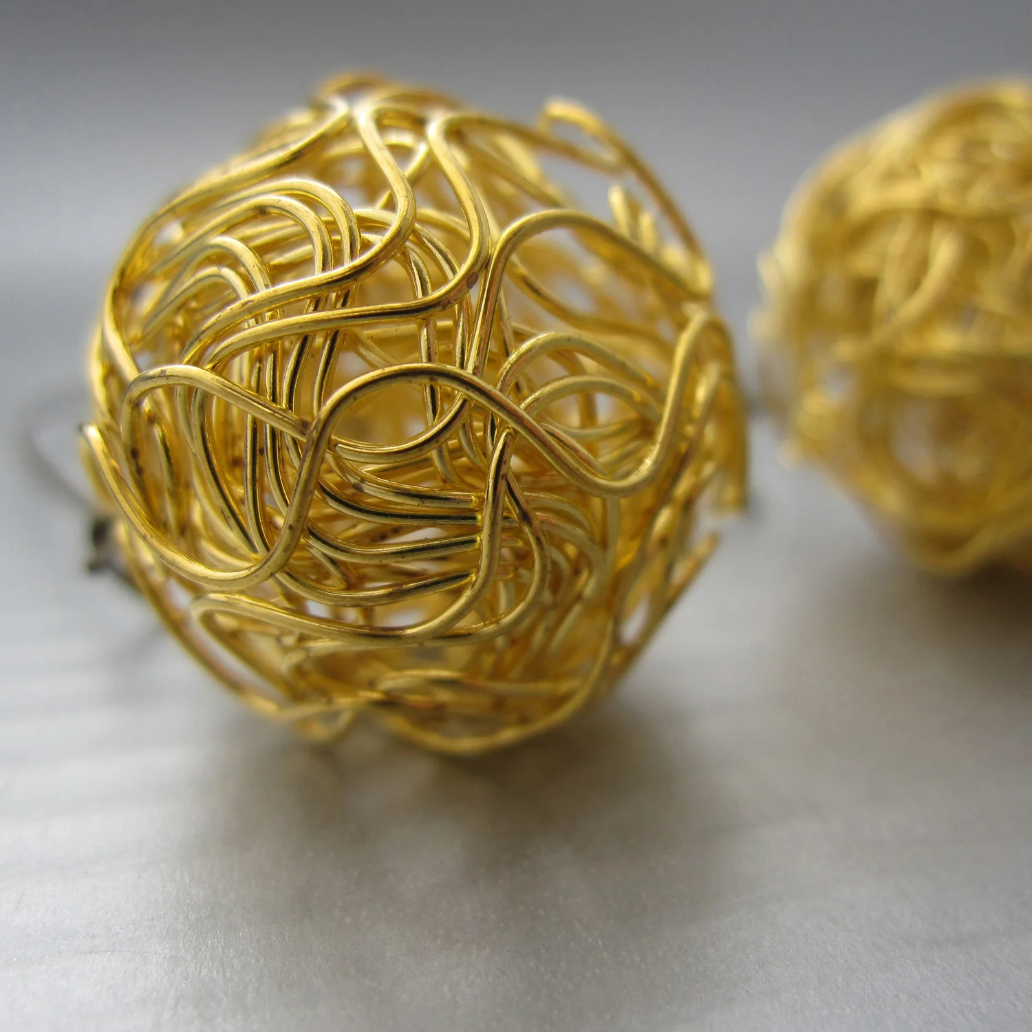 a detail of the nido earrings