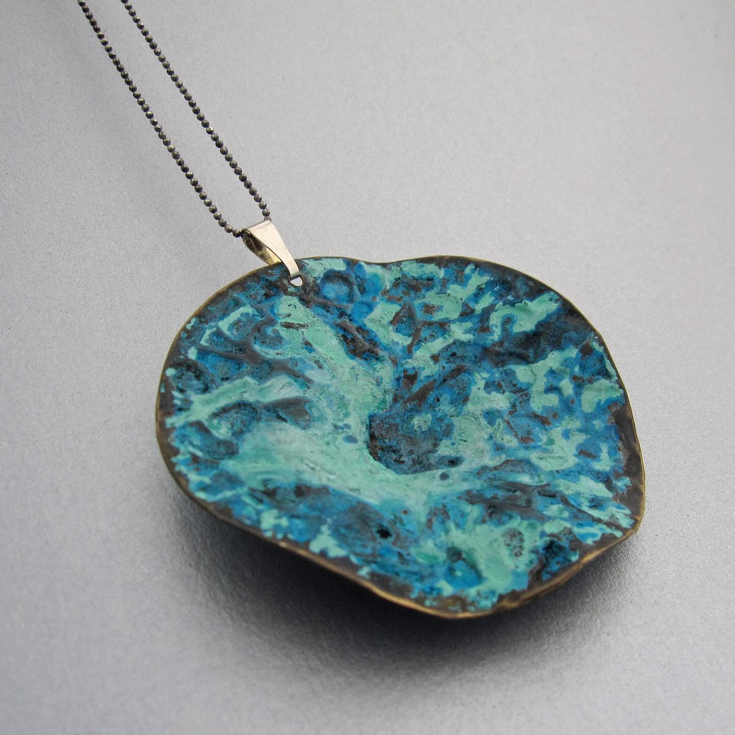 A new and distinctive necklace - to wear in two different ways - from my one of a kind collection. The piece is inspired by a Propora. Handcrafted in copper with a patina created with household products, this pendant comes with an oxidized silver cha