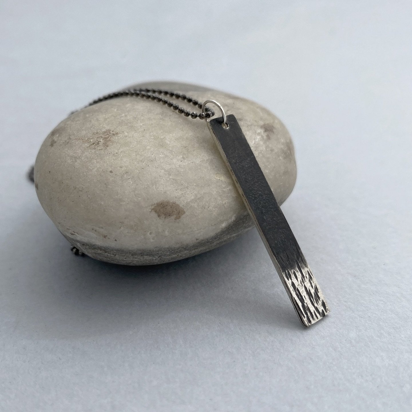 Just off the bench: piccole impronte necklace
Small prints on the ground inspired the design of this one-of-a-kind, delicate necklace handcrafted in sterling silver with partial patina

Link to buy: https://www.maddalenabearzi.com/handmade-limited-ed
