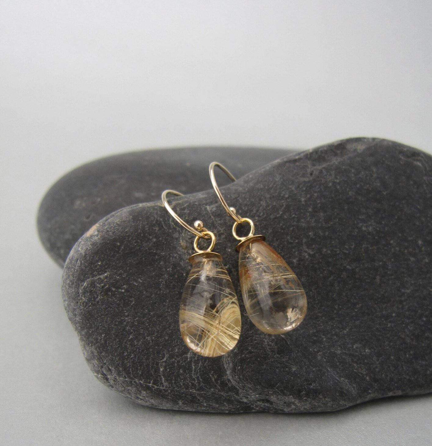 Looking for something special, distinctive and timeless? 
Gold fragments (&ldquo;frammenti d&rsquo;oro&rdquo; in the language of the designer) of rutilated quartz mounted on solid gold give life to these  elegant, one of a kind and handmade earrings.