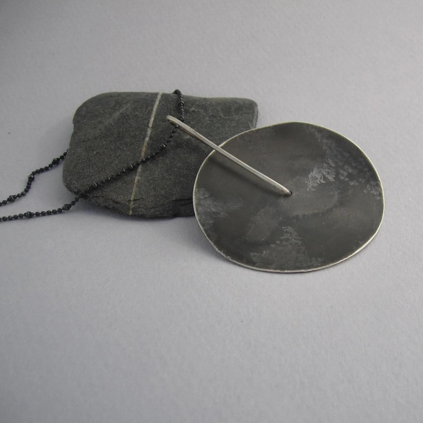 Inspired by the mystery of a dark, textured planet, this one of a kind, bold sterling‑silver necklace is all about presence. Hand‑sculpted with a raw, tactile surface, it creates a striking statement that instantly stands out.
Available here: https:/