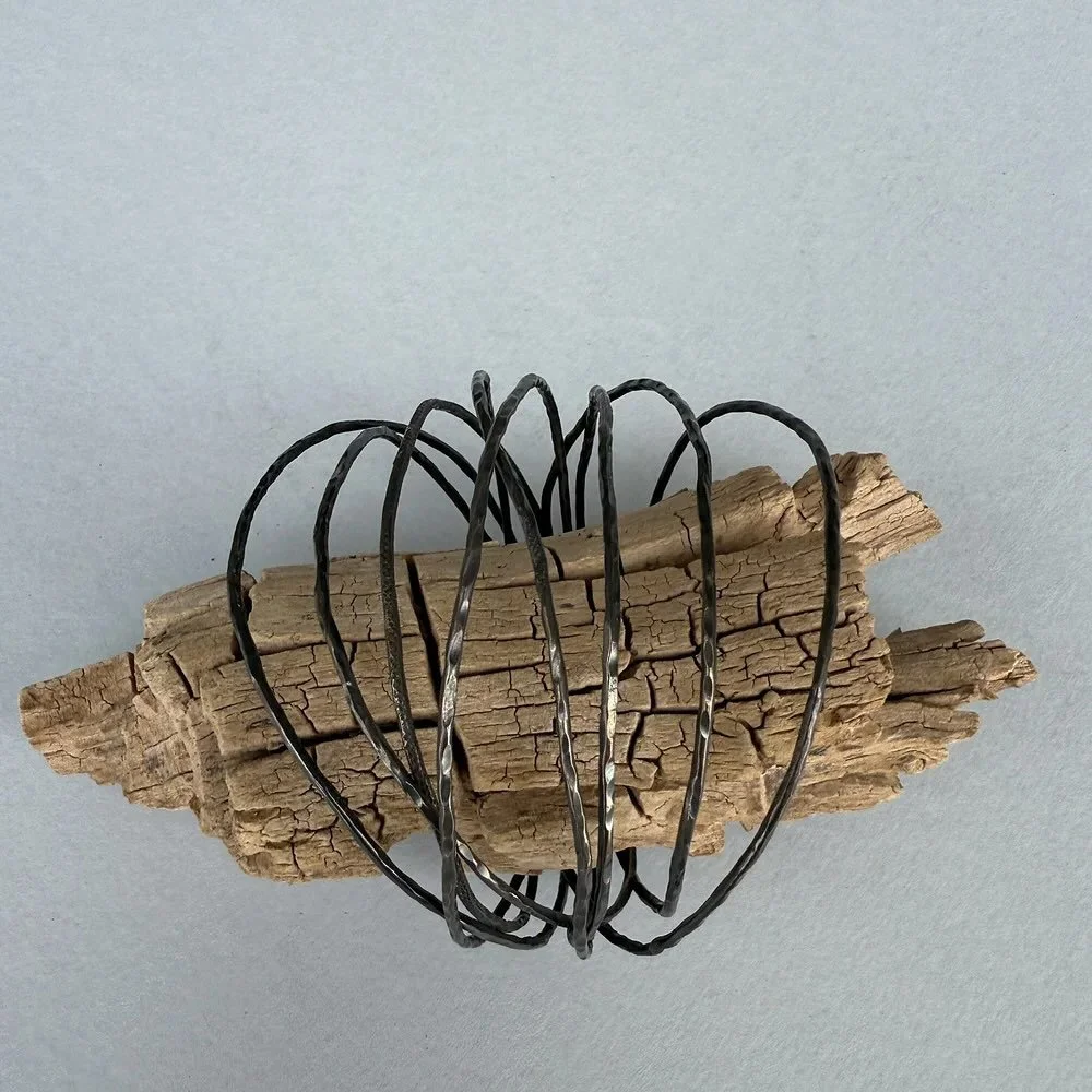 Just drooped in our one of a kind online shop: the Fili D&rsquo;Alga Intrecciati cuff.
Inspired by strands of black algae, this handcrafted bracelet blends mixed metals into a bold, organic design. 

Image+design: maddalenabearzi