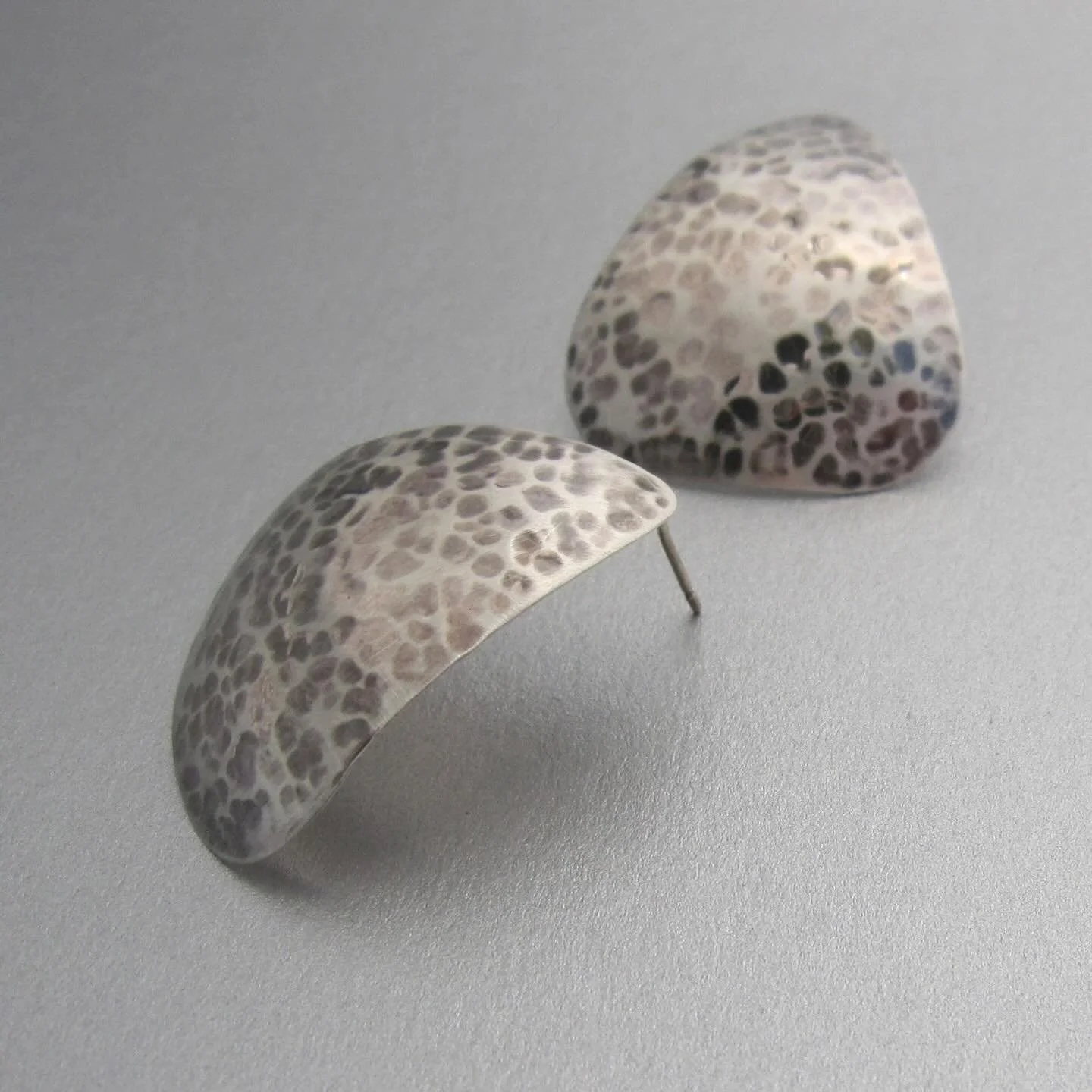 Scaglie di Pesce Earrings 
Inspired by the shimmering texture of fish scales, these elegant earrings are handcrafted in sterling silver&mdash;light, organic, and designed to catch the eye with every movement.
Find them here: https://www.maddalenabear