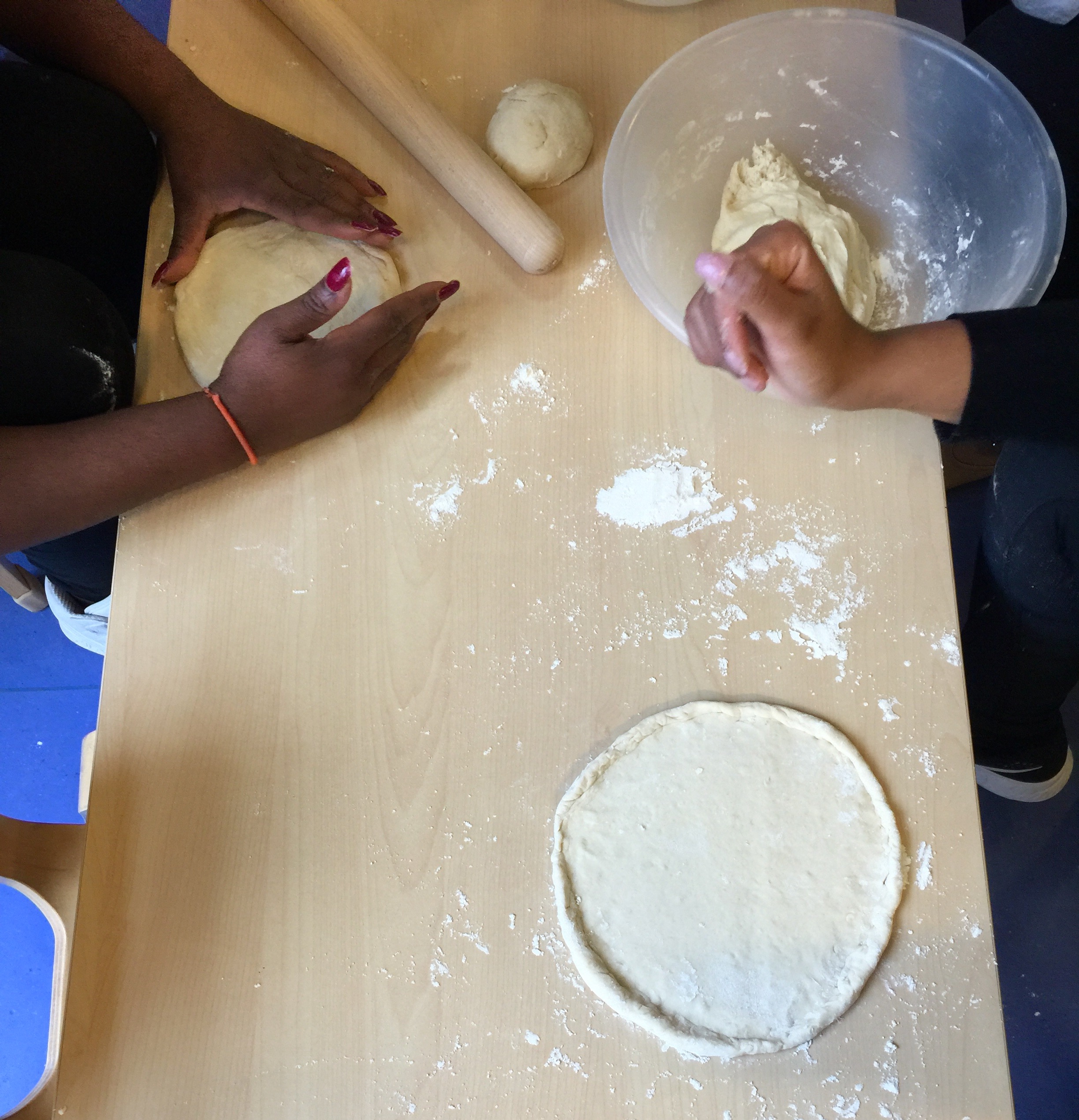 making and shaping pizza dough