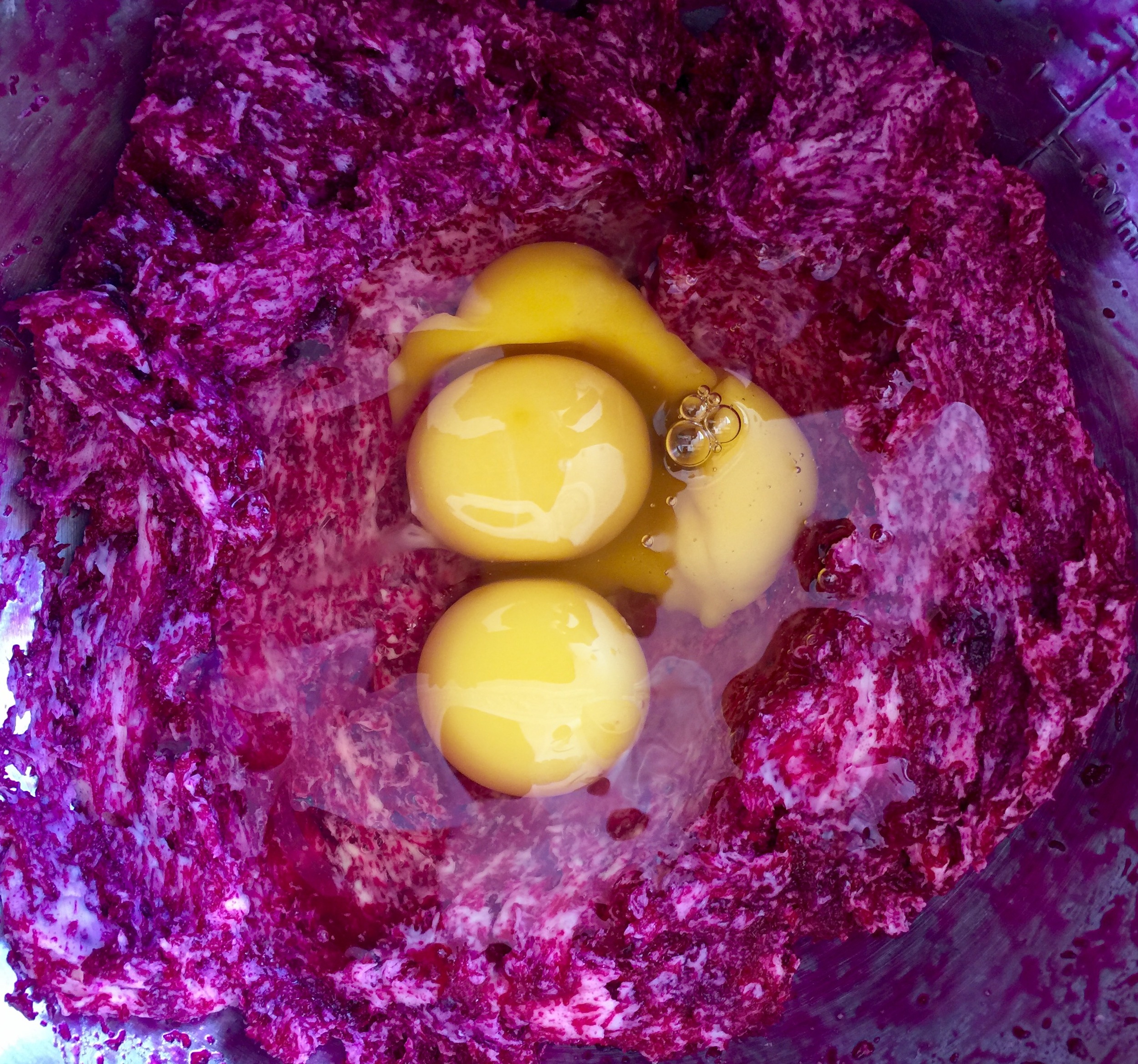 adding the eggs to the mixture