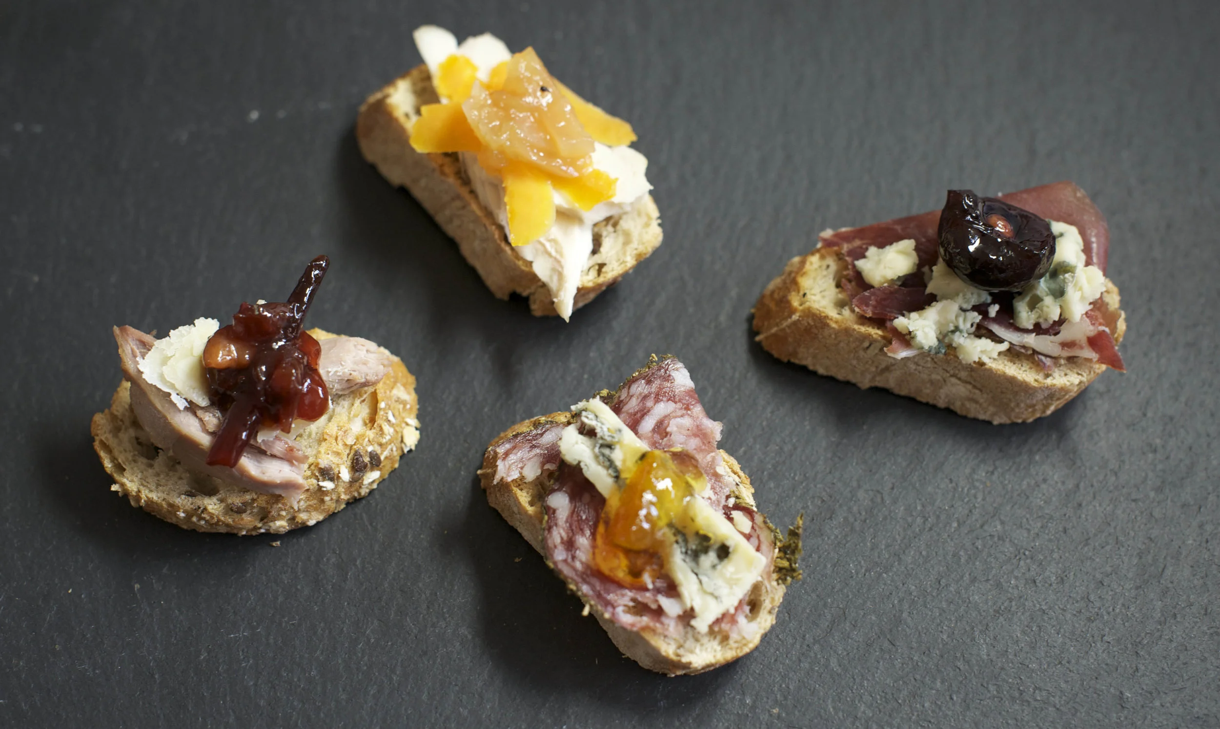 Smy Goodness canapes - (from left) Roast duck, parmesan and plum gumbo; Chicken, Red leicester and apple and pepper chutney; Salami, gorgonzola and Seville orange marmalade; Prosciutto, gorgonzola and black cherry and black pepper compote.