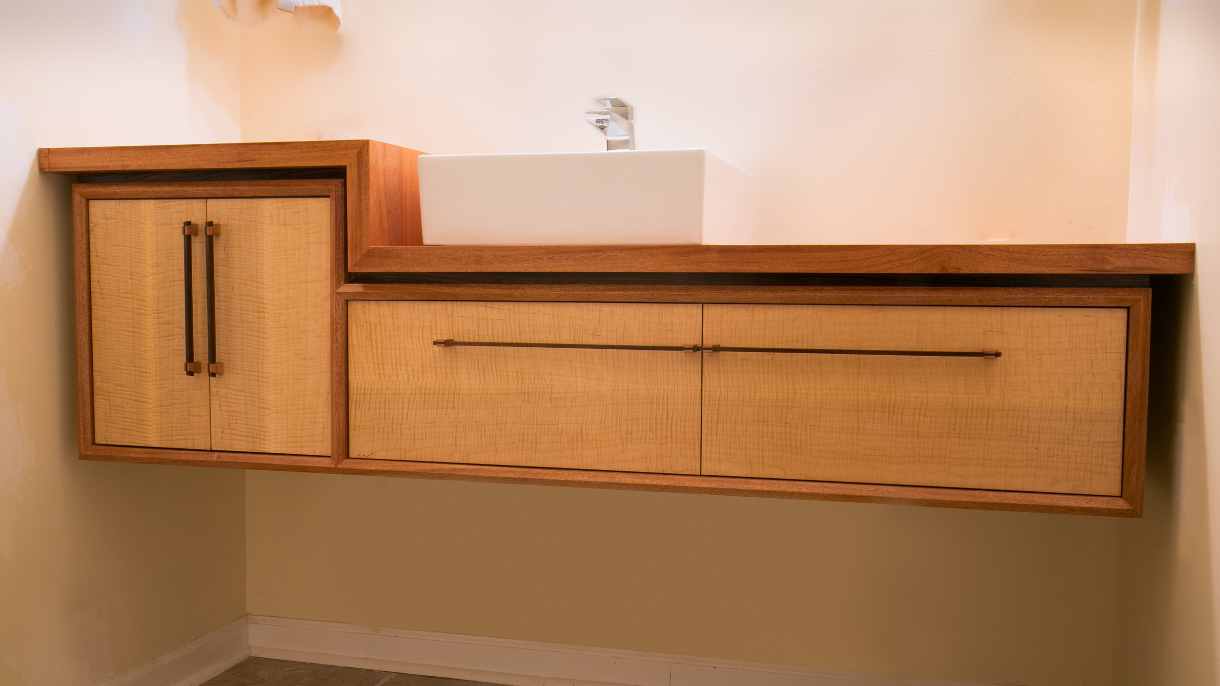 Sleek, modern floating bathroom vanity: Curly Maple with African Mahogany and Indian Rosewood detail