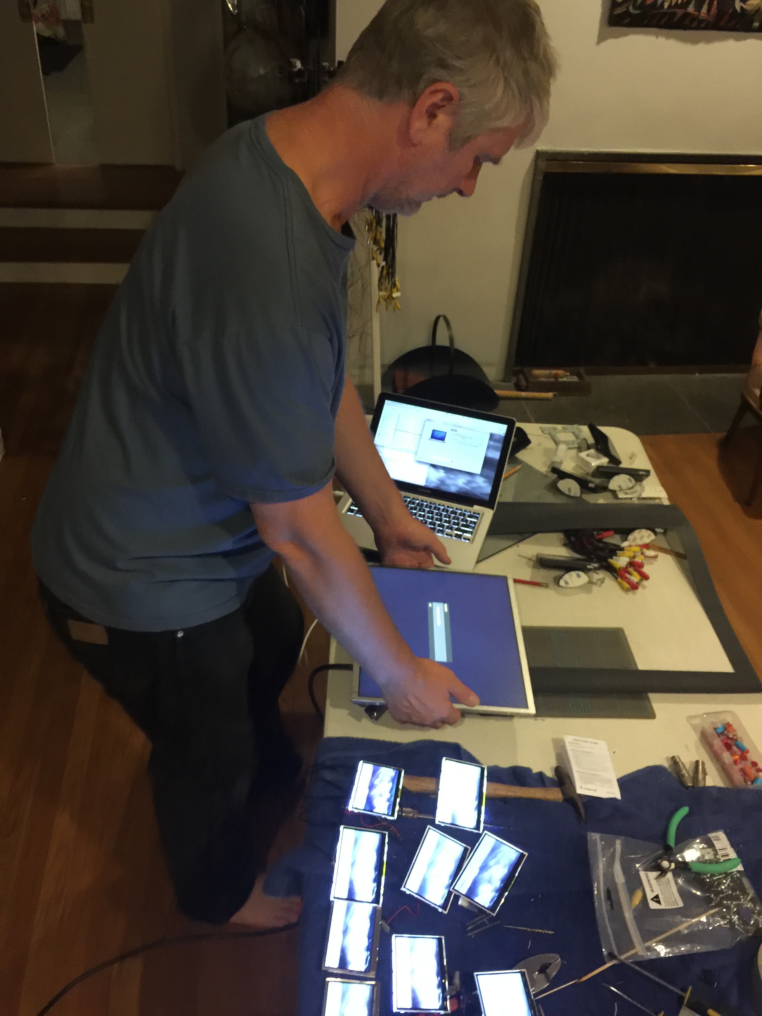 Andreas working with recycled monitors for Waterfall Sculpture