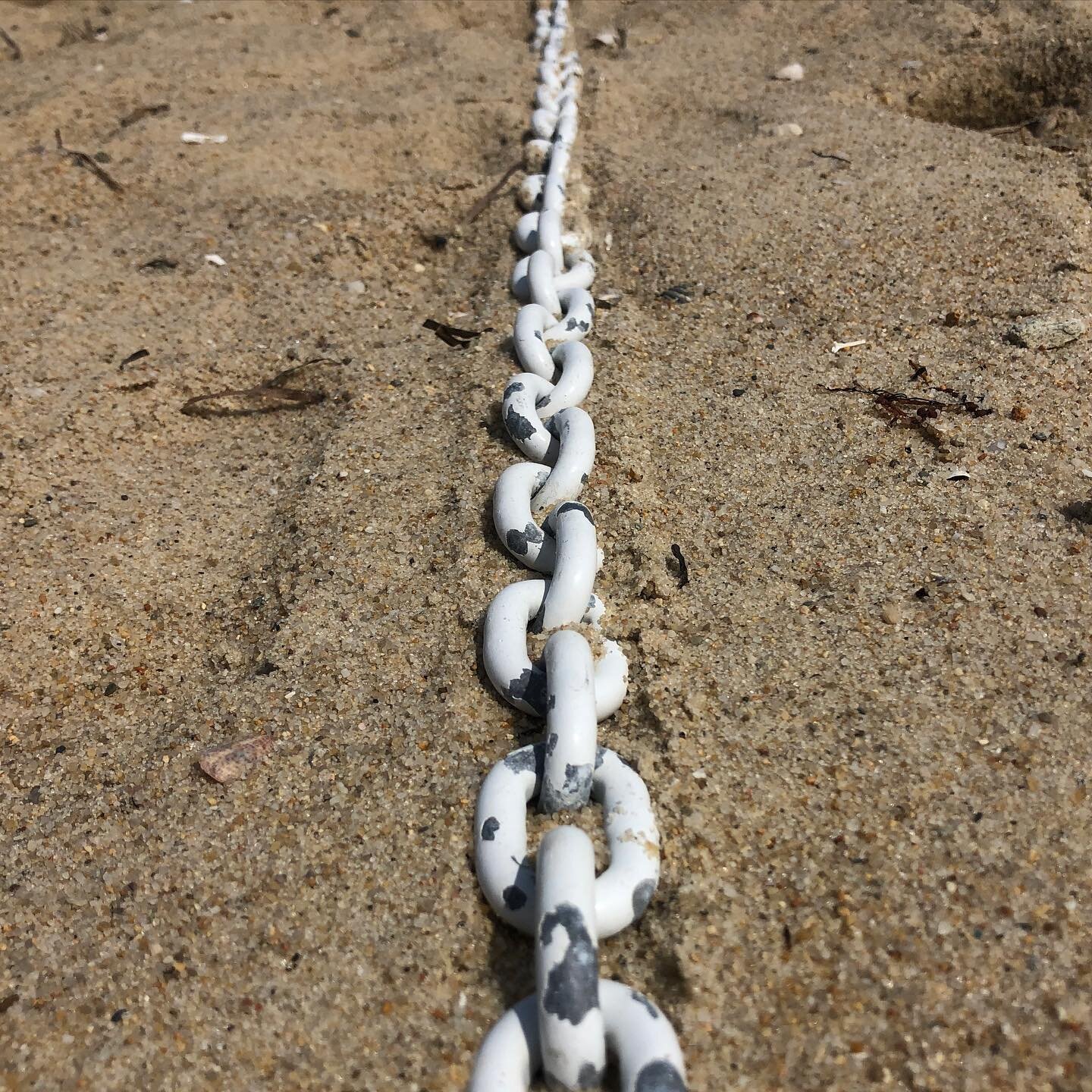 Plastic coated metal chain in sand #plasticcoatedworld