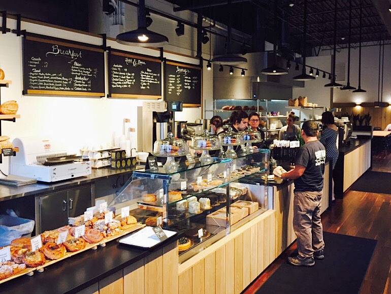  A customer on opening morning grabbing coffee and a bite on his morning commute..