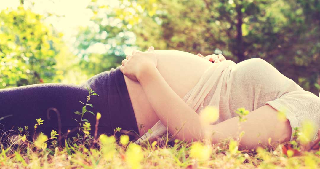 Pregnant woman outside