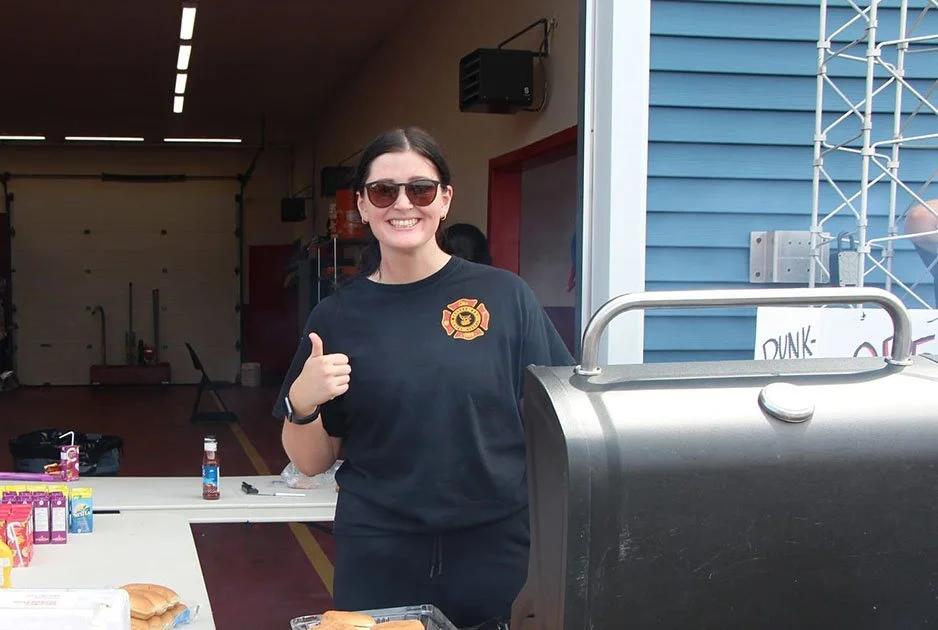  Witless Bay volunteer firefighter McKenna Walsh served up barbequed grub and smiles at the third annual Witless Bay Volunteer Fire Department open house. It was held this past Saturday as a part of the community’s Witless Bay Days festival. The department estimates some 350 visitors passed through the station. Photo courtesy of the Witless Bay Volunteer Fire Department. 