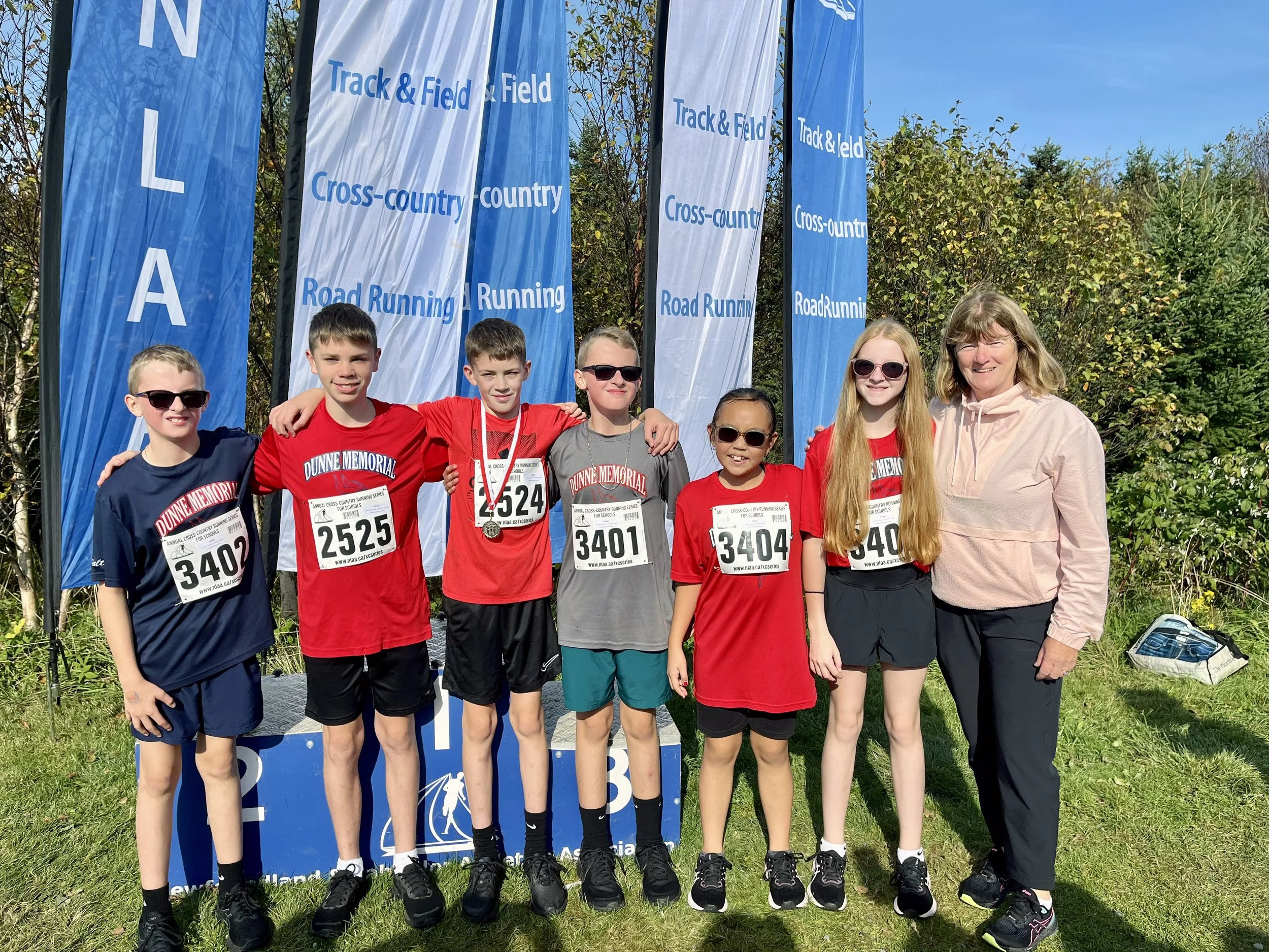  A number of runners from Dunne Memorial Academy in St. Mary’s participated in the Newfoundland and Labrador Athletic Association’s (NLAA) X-Country Series, held over three weekends in Bowering Park each Fall. Some days are beautiful for running, and others are not, but the weather doesn’t deter the runners from Dunne Memorial. In left photo, going from left to right, Dalton Corcoran, Noah Van De Bulk, Kellan Tobin (who placed first in two out of his three races and second in his third), Connor Corcoran, Katie Toope, Skye Corcoran and coach Karen Hearn. Meanwhile, Heather Squires, Kain Tobin, and Noah Van De Bulk represented the school at the School Sports Newfoundland and Labrador (SSNL) Cross Country Running regional tournament held in Carbonear earlier this month. In right photo are coach Karen Hearn, Heather Squires (who placed 14th in the senior girls race with a personal best time), Kain Tobin (who placed second in the senior boys race), and Noah Van De Bulk (who placed third in the junior boys race). Submitted photos  &nbsp; 
