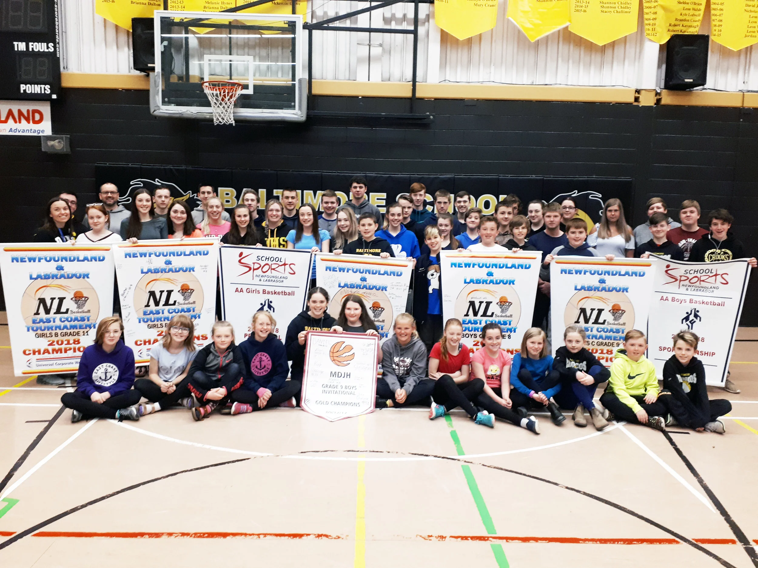 Students at Baltimore School in Ferryland gathered recently for a group photo with all the provincial basketball banners they capturred this past season.