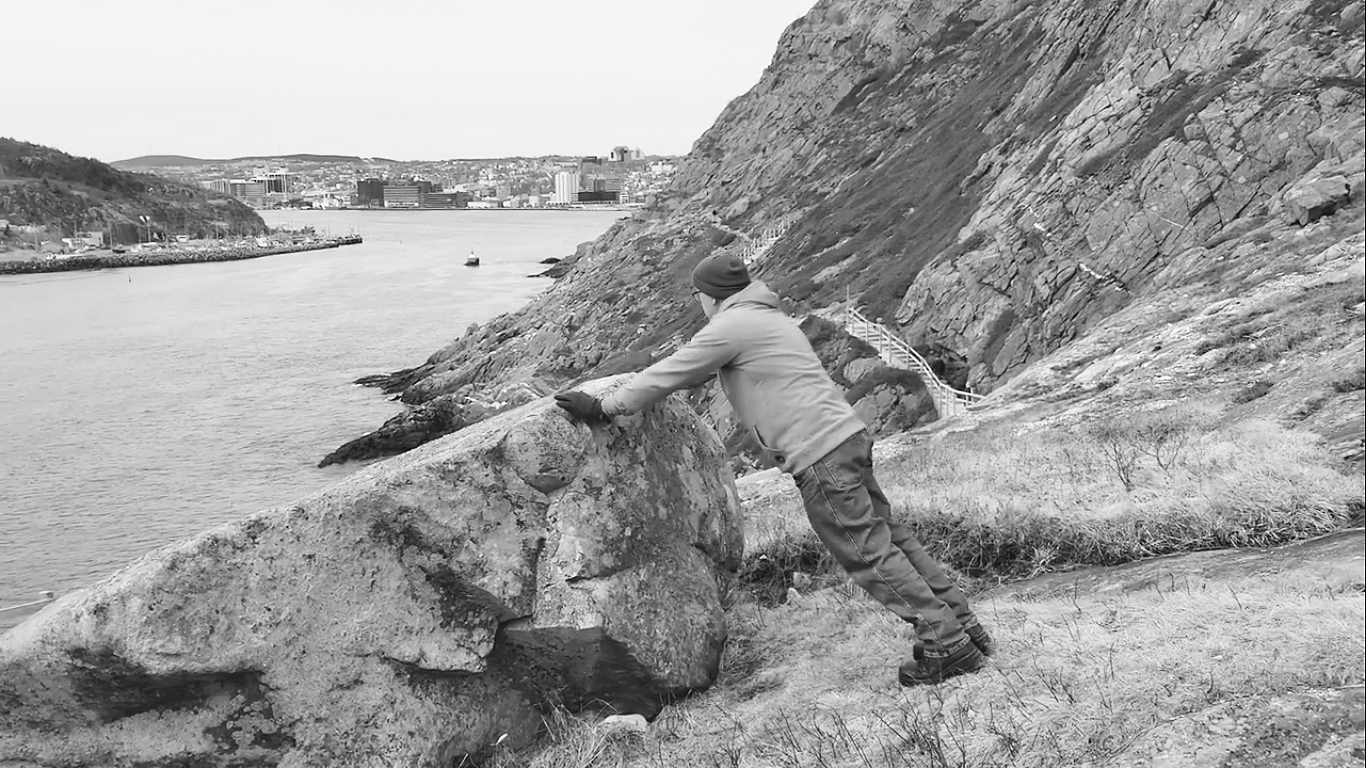 In a still from one of his push up videos, Bill Guiney does push ups atop scenic Signal Hill. Submitted photo