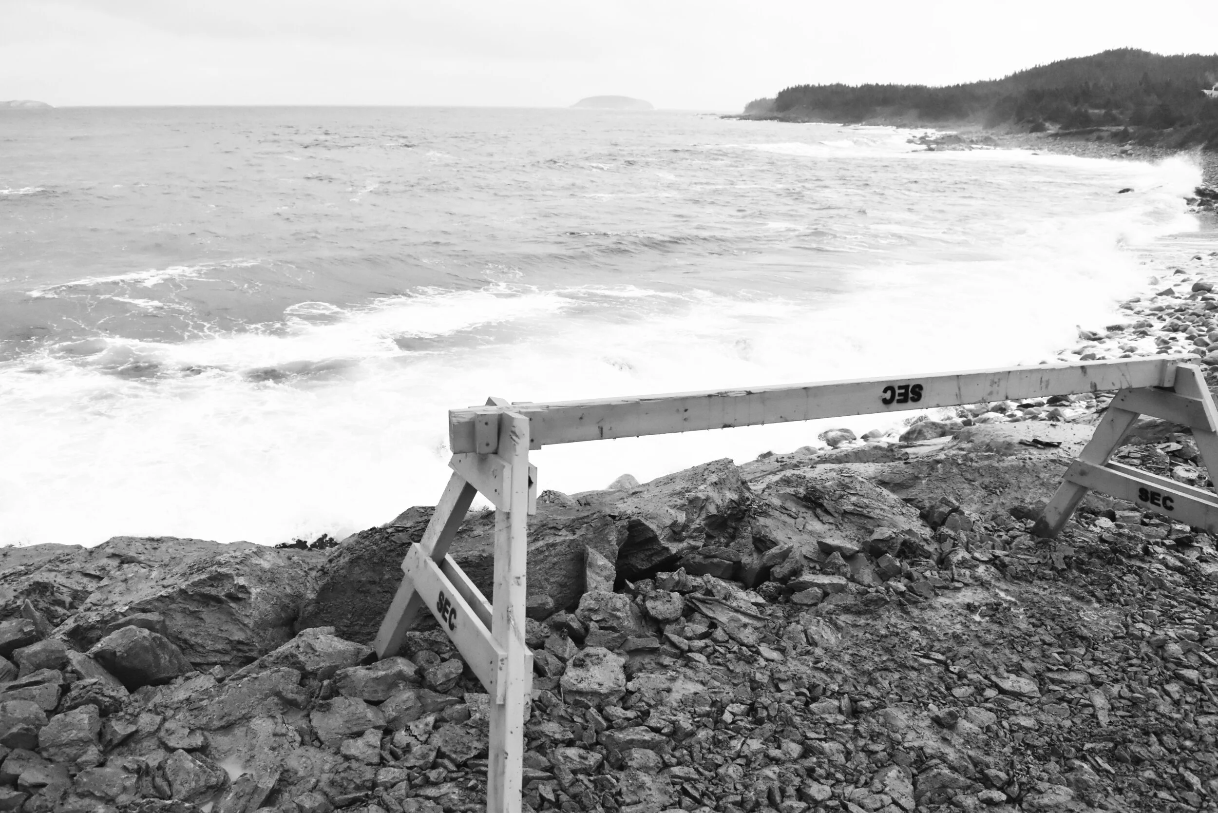  Without the placing of large stones in front of the small parking area at the end of Gallows Cove Road, the small area that serves as a parking lot for users of the East Coast Trail is in danger of being washed out by a heavy sea. 