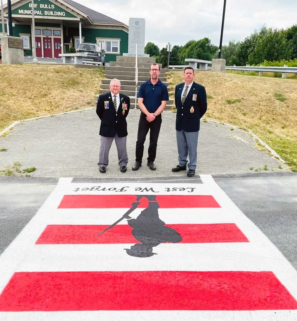 The Town of Bay Bulls unveiled a new veterans crosswalk on August 14, just a few days after approving the crosswalk in a public meeting of council. Retired service members Lee Dunne and Bill Gushue joined mayor Keith O’Driscoll for the unveiling. From left are Gushue, O’Driscoll and Dunne. Town of Bay Bulls photo